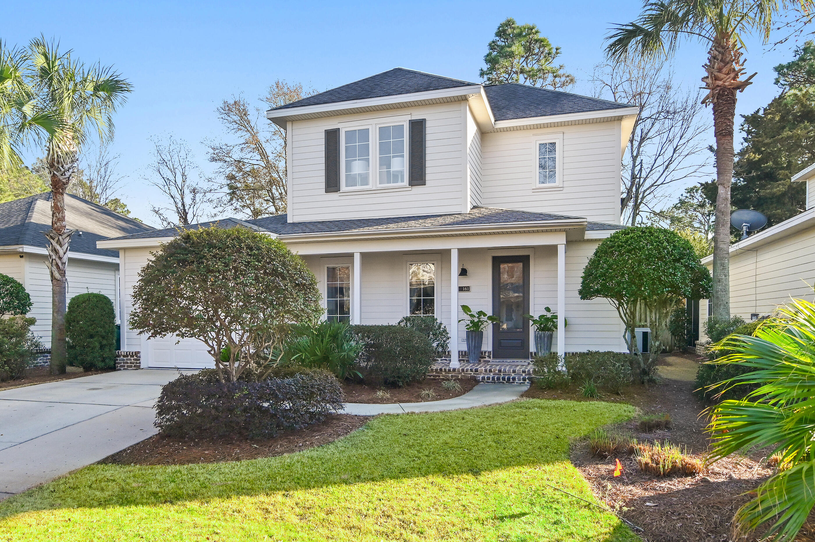 Charming Huff-built home in Phase I of Church Street Village on private homesite. Quality finishes with a full brick perimeter add timeless appeal. The open living, kitchen, and dining areas flow naturally to a screened porch and private backyard retreat The spacious layout features the primary suite on the main floor, plus two large bedrooms and a loft upstairs with a full bath. The loft offers perfect flex space for an office or playroom. Thoughtfully updated with newer appliances, water heater, and main HVAC system. An attached garage provides parking and extra storage. The  amenity rich neighborhood features tree-lined streets, included lawn care, and amenities such as a pool, playground, fitness center, and more-so close to the beach and all that South Walton offers.