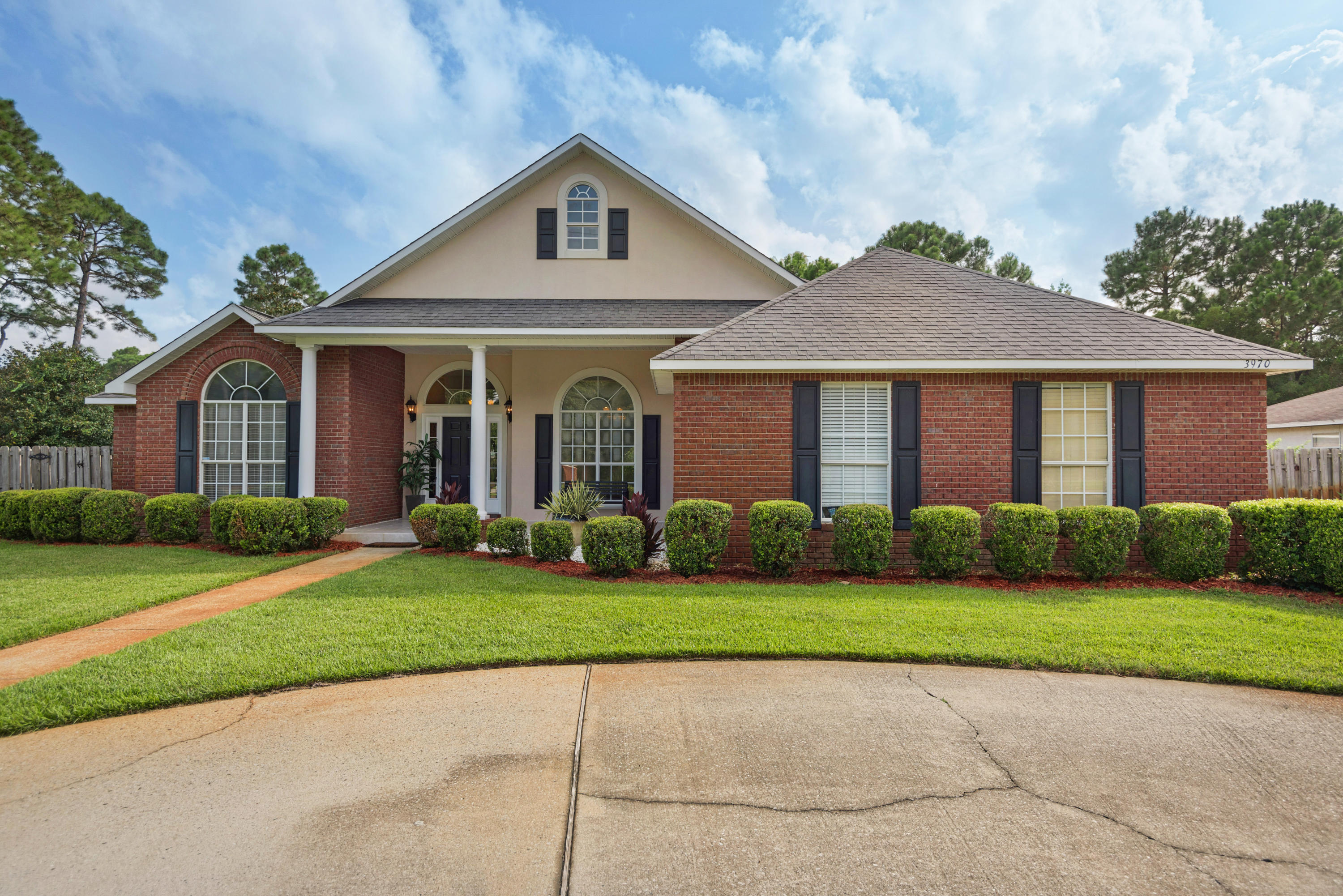 This is a gorgeous brick home with 4 bed and 3 and a half bath with an open floor plan. It sits on a beautiful large lot on the prestigious Indian Trail in the heart of Destin. Start with the grand entry, high ceilings and brazilian cherry hardwood floors that extend to kitchen, all living areas and office room. The architectural features in this elegant home includes beautiful crown molding, tray and vaulted ceilings, Gas fireplace, large windows, two living spaces and a spacious office. The kitchen is optimally designed for entertaining with stainless steel appliances, granite countertops, and plenty of extra seating at the bar along with a walk in pantry and a breakfast nook. The huge master suite is with beautiful large windows overlooking the pool and his and her walking closets. Brand New Roof.