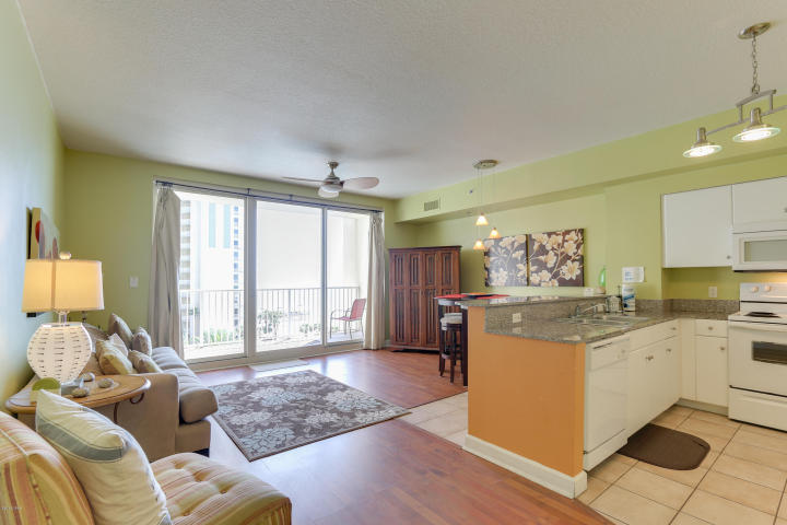 Located in the very popular Shores of Panama development, this 1Bed/2Bath+Bunk has it all including a private parking space on the same floor!! This fully furnished and rental ready property has been professionally decorated, custom painted and has upgrades galore. Features Include: 1 bedroom and a bunk Room, 2 full baths, hard surface flooring through-out, gulf front living room, 9ft ceilings, granite countertops & breakfast bar. Large Terrace offers the perfect view - you not only see the most beautiful beach in the world, you get the most beautiful lagoon pool in all of Panama City Beach! The Shores of Panama offers resort style amenities including 13,966 SF gulf side pool and hot tub, large heated indoor pool & hot tub, tropical landscaping, bridges, fountains, video bank, media room,