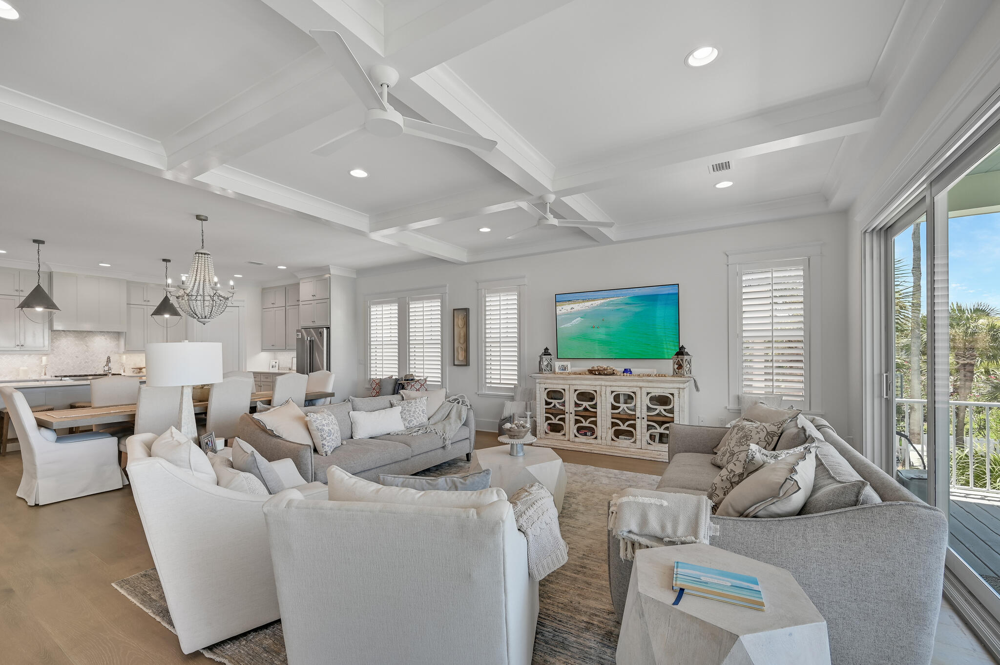 Exceptional vistas and attention to detail define this recently constructed coastal retreat. This contemporary lakefront home affords its owner with extraordinary views of Lake Caroline and the Destin Pointe community. It's well appointed and has been meticulously thought out from design to conception with its generously sized and thoughtful layout. There are five bedrooms, each with their own ensuite; one of which is a bunkroom with four bunks, which make this home an ideal retreat for large families. In total there are five and a half baths; giving each bedroom including the bunks, their own bath. Interior finishes are impressive with notable features such as tongue & groove ship lap siding, tall ceilings, private elevator; along with wood and tile floors throughout. The first floor features an open living concept with kitchen, dining and living all open to one another and each enjoying the lake and pool views. The kitchen offers custom cabinetry, quartz  countertops, stainless steel appliances including a double oven as well as an oversized pantry with ample storage. Adjoining the kitchen is the generously-scaled dining and living areas which flow out onto the expansive rear deck that spans the entire width of the home allowing for easy indoor/outdoor living. Also on the first floor is a private guest suite with its own bath and private balcony. Journey upstairs and you will discover the finely appointed lake side master suite with large ensuite and balcony that overlooks the lake and pool. The master features a spa-like ensuite bathroom complete with a large soaking tub, dual vanities and a walk-in shower. The second floor also includes three additional bedroom suites with private baths including the custom-built bunk room with its own private bath. This home was thoughtfully appointed with a large laundry room and large closets on both the first and second floors; along with outdoor shower and ample covered parking and outdoor storage. Destin Pointe is a private, gated island community located in the heart of Destin's harbor district. It features 24 hour security, 3,000' of deeded beach access, two lakes, shuttle service to and from the beach, two pools, two tennis courts, access to the East Pass with snorkeling and fishing as well as close proximity to the world class restaurants, boating, shopping and entertainment Destin has to offer!