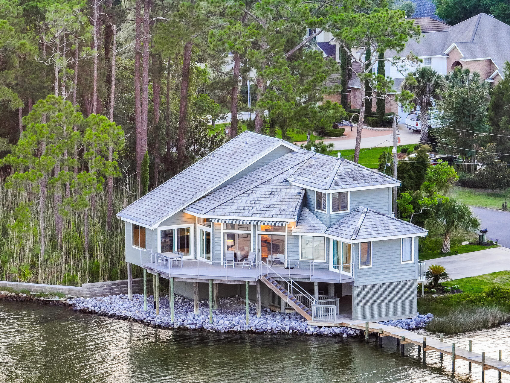 Welcome to an exceptional custom-built home by renowned builder Gary Miller, situated directly on the coveted Rocky Bayou.  SHORT TERM RENTALS ALLOWED!!!

The property has a dock on deep water, with a covered lift area, swim platform and additional pilings for mooring sailboats and larger vessels. 

Inside, the nautical-inspired, open layout offers breathtaking views of the bay and features three bedrooms, a den, a laundry room and newly-remodeled bathrooms. A professionally-designed kitchen is perfect for entertaining.  Two large decks offer exceptional waterfront views with the luxury of complete privacy.  
Come see and feel the magic of the bay and this beautiful property!