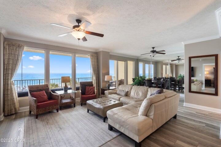 Welcome to Gulfcrest Unit 302—the ultimate beachfront escape you've been dreaming of. This oversized 2-bedroom plus bunk, 2-bath Gulf-front condo offers one of the most desirable and functional floorplans on the beach. Perfectly situated on the third floor, unit 302 delivers sweeping views of the emerald Gulf waters, the sugar-white sandy beach, and stunning sunsets—all views available from the oversized balcony, living room, dining area, kitchen, and master suite. Inside, you'll find a bright, open layout featuring 9-foot ceilings, expansive glass sliders, and a refined coastal-chic design that creates the relaxed feel of a beach house with the low-maintenance ease of condo living.