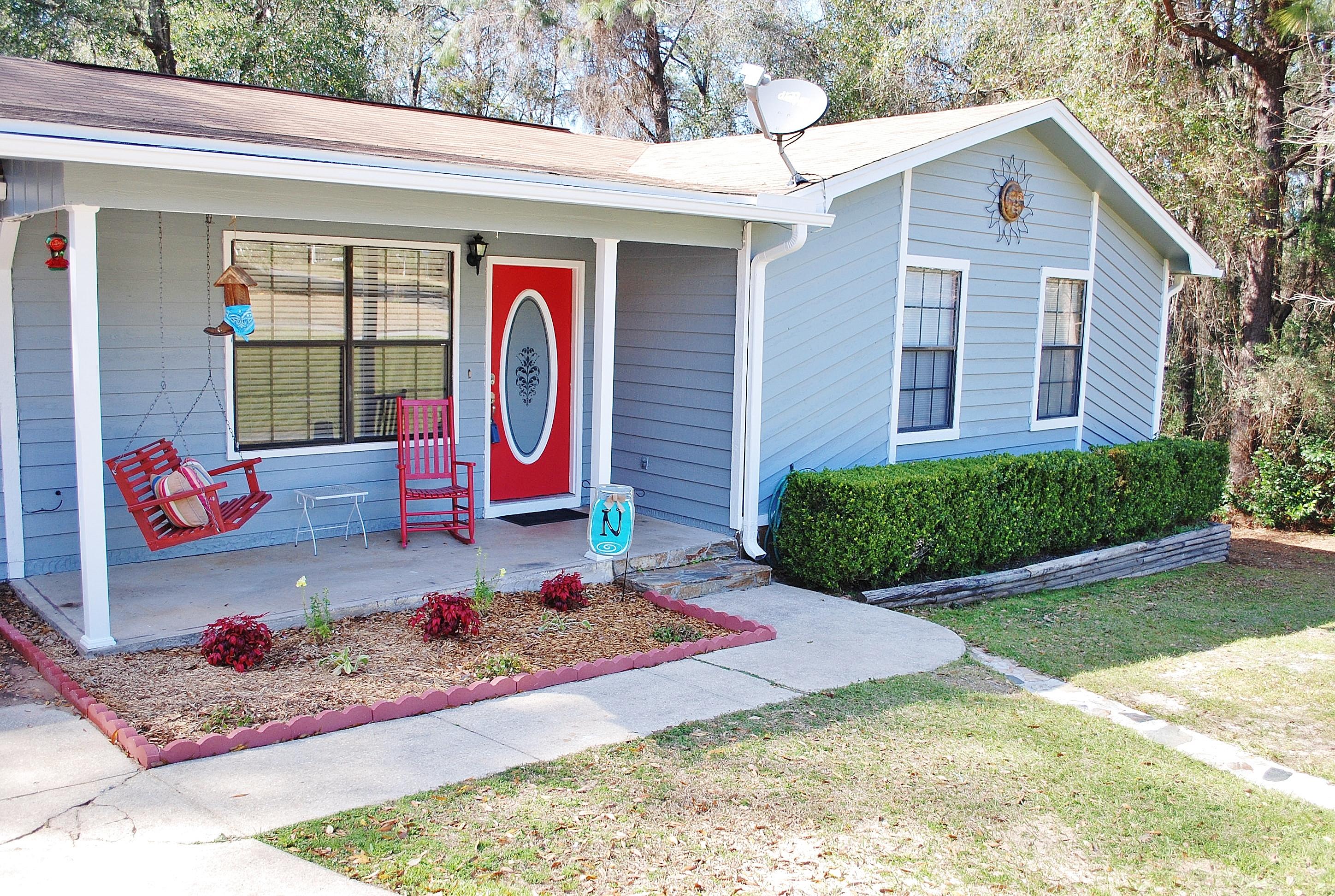 You must come see this completely remodeled adorable home tucked away on a quiet street, 1/4 acre lot with guaranteed privacy. The sellers have lovingly made vast improvements to this home in the last few years! From the new roof(2013), completely painted exterior, new exterior doors, all new lighting throughout including recessed, all new flooring to include new hand scraped 6'' plank flooring in the main living areas, and new laminate wood and carpet in all bedrooms, new tile in bathrooms, and a gorgeous new kitchen with stainless appliances, a granite topped bar and counters, new baseboards throughout and newly painted interior doors and hardware, scraped ceilings (no more popcorn!), and refaced cabs in kitchen and baths. New HWH 2014. Sit and enjoy the evenings or entertain from your covered back deck while overlooking your gorgeous wooded backyard.  No one will be building on one side or close behind. You must see it to decide for yourself how perfect this house is!