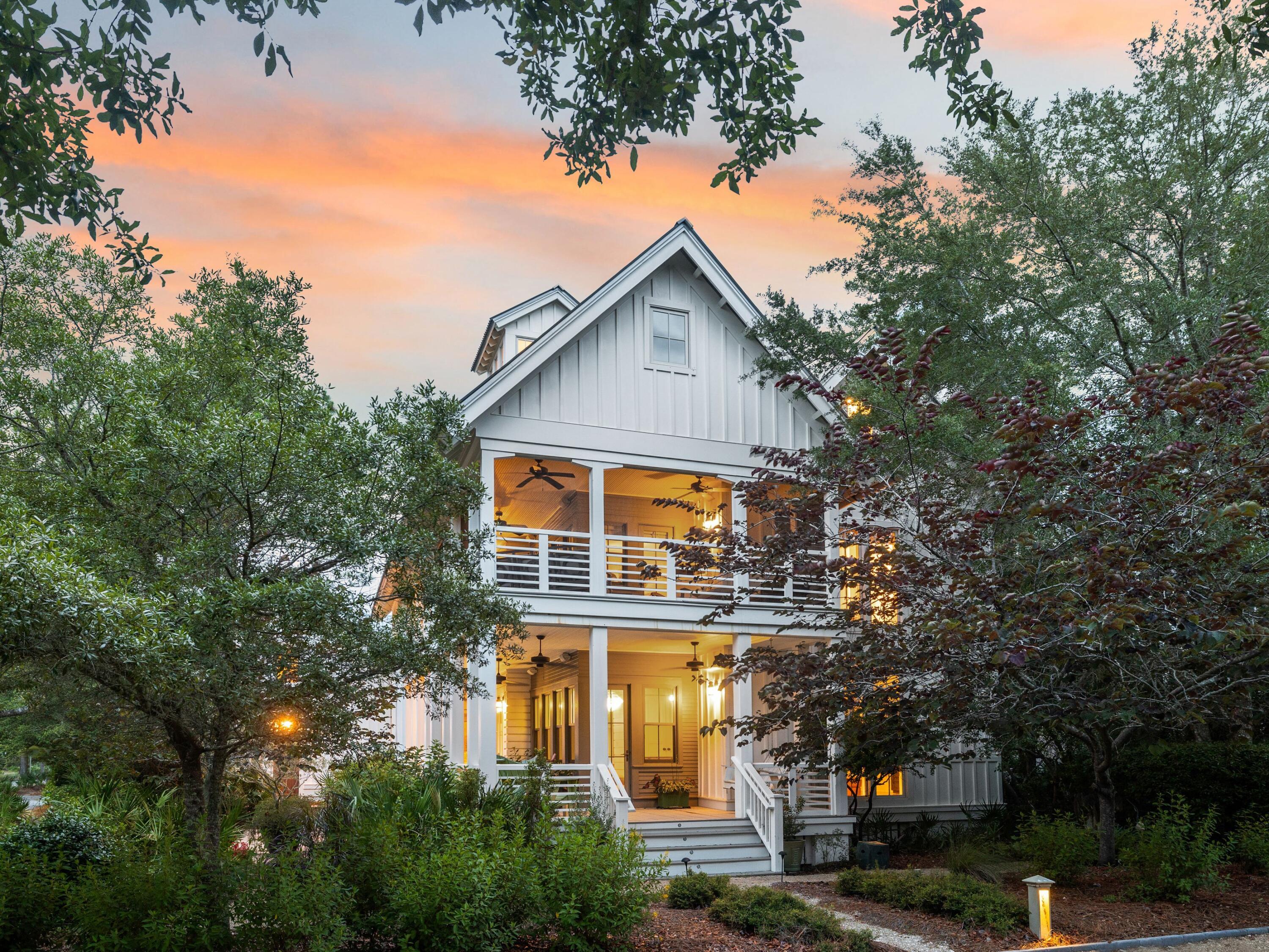 A timeless coastal retreat nestled in the heart of WaterColor's coveted Lake District, this residence is one of only four distinctive homes built by St. Joe as signature properties—all situated along High Street. Uniquely designed and unlike any other home in the community, it offers a rare opportunity for those seeking character, space, and long-term value in one of 30A's most sought-after neighborhoods. Positioned on a private corner lot with a view of park land that will never be developed, the property offers both serenity and space for future enhancements, including the option to add a pool. Spanning over 4,000 square feet, the home includes five bedrooms, five bathrooms, and a detached studio carriage house above a two-car garageperfect for guests or multi-generational living.

A wraparound porch shaded by mature trees sets the tone for relaxed coastal living, while inside, soaring vaulted ceilings and abundant natural light create an inviting and open feel. The main level features a generous living area with a custom bar, a well-equipped kitchen with Viking appliances and ample cabinetry, a guest bedroom with full bath, and a spacious laundry room.

Upstairs, three ensuite bedrooms offer comfort and privacy, while the third level hosts a large loft-style suite with a wet bar, built-ins, and access to a crow's nest toweran elevated space with panoramic views ideal for enjoying sunset skies. The detached carriage house provides flexible space with a private entrance and full bath.

Just a short stroll to the Frog Pool, Lake Forest footbridge, and WaterColor Beach Club, this home combines location, scale, and architectural distinction. With access to WaterColor's extensive amenitiespools, parks, tennis courts, nature trails, and the Gulf of Mexico's iconic white-sand beachesthis property presents an exceptional opportunity to invest in a one-of-a-kind home with endless potential in a premier coastal community.