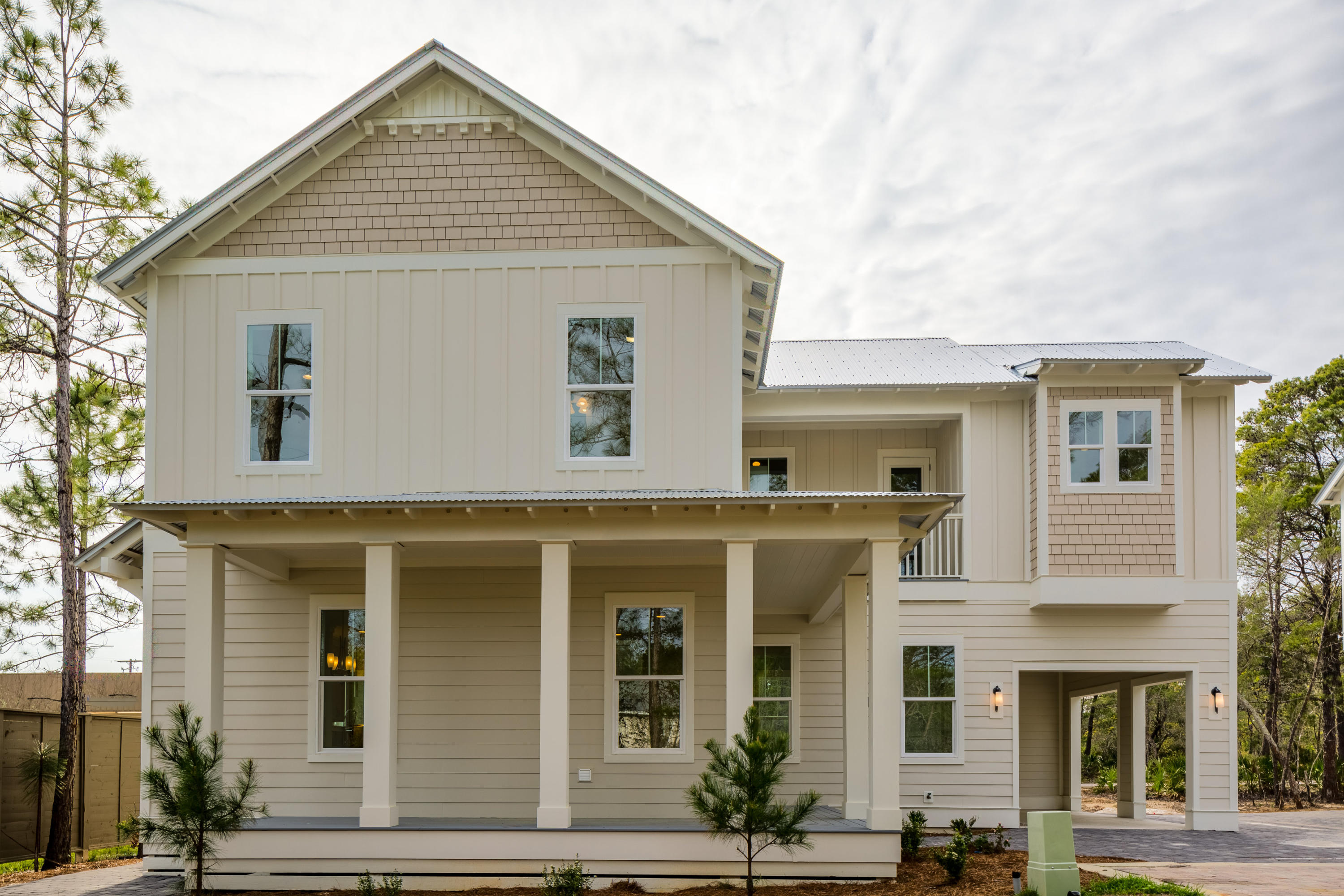 This new build Allamanda plan features more than 2,200 square feet of beautifully designed space with two porches (one screened) to enjoy outdoor living. The first floor wraparound porch opens up to an open-concept living room, dining area and kitchen highlighted by a large center island, maple wood shaker style cabinets, soft close doors and drawers, quartz countertops, stainless steel appliances + more. Each bedroom has its own ensuite bathroom plus a gorgeous freestanding bath tub in the master suite. The homes in The Village at Grayton Beach are built with impeccable quality and exceptional durability and safety features. Just a few of these incredible features include JELD-WEN impact-resistant windows, 2x6 exterior framing, 2-10 home buyers warranty, Galvalum metal roof + much more. The Village at Grayton Beach is a charming 47-home community conveniently located between Scenic Highway 30A and Highway 98 and offers an outstanding zero-entry swimming pool. Restaurants, shops and activities are just a short bicycle ride away along with historic downtown Grayton Beach, public beach access and the award-winning Grayton Beach State Park.