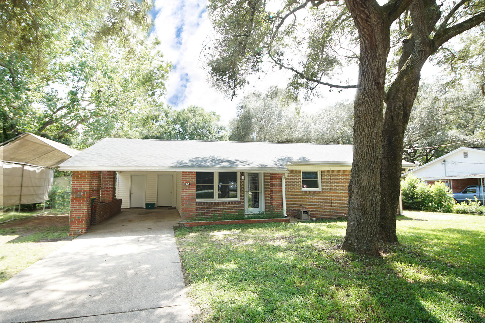 This centrally located 4 bedroom 2 bath BRICK home has so much to offer!!!!  2 living areas, split bedroom floor plan, HUGE FENCED IN YARD, all new high impact double pane windows, NEW ROOF, new laminate flooring in front living area as well as the front 3 bedrooms and a 16 x 20 steel storage shed WITH ELECTRICITY!!!  There is also another smaller shed!!! Kitchen with Corian counter tops, GAS STOVE, and tiled flooring. One living area is located in front of home along with three bedrooms that share an updated full bathroom. The back of the home has a SPACIOUS FAMILY ROOM that you will love!!! The Master bedroom is very roomy and has a separate FULL BATH with a WALK-IN SHOWER. The backyard is fully fenced with a large patio and gas hook up for the BBQ. This neighborhood has NO HOA!!! Call today for your appointment to see this great home!!