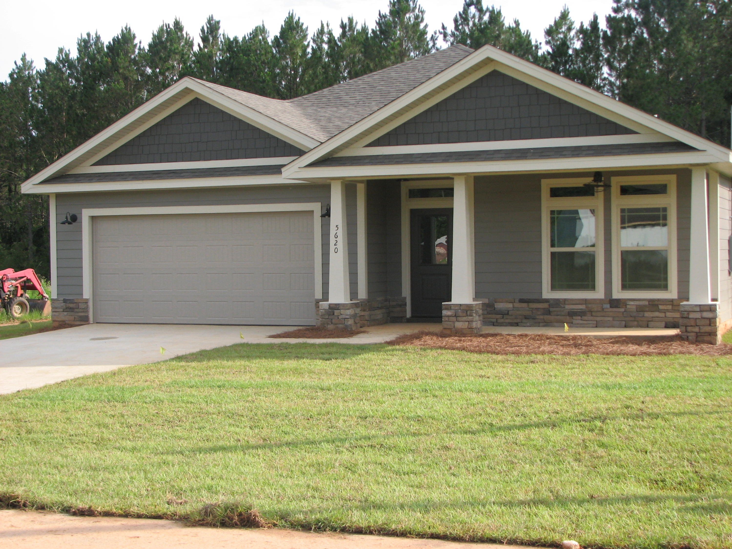 This 3 bedroom 2 bath home features granite counter tops and a high & low bar which is open to the living area. Split floor plan with master suite offers separate shower/tub, double vanity, and large walk-in closet master. Home has 9 foot ceiling finish throughout, tile in all wet areas, and fans thru-out. Craftsman styled, Hardi Plank exterior with stacked stone accents and a side loading garage. Price Farms is a quiet street just 2 blocks from Baker School (K-12). By BIA award winning builder JEREMY STEWART CONSTRUCTION. Photos are of a similar home.