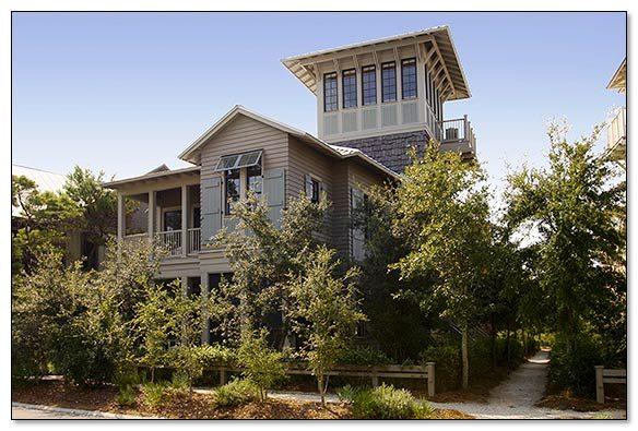 This distinctive Florida Beach house designed by Tom Christ is located in WaterColor's Premier Park District and affords many upgraded custom features. The first level delivers two spacious guest suites which include their very own private baths & walk in closets. One of the suites offers a discreet sleeping porch. The first level also provides a laundry/mudroom, private screened logia complete with cabana bath and a two-car garage. The spacious second level offers an open concept kitchen, dining and living area, a cozy fireplace and grand piano vestibule ideal for entertaining friends and family. Cherry floors and vaulted ceilings with heavy beams add to the ambiance of this home. Located on the home's second level, the expansive master suite provides an over-sized bath with soaking tub, walk-in shower, roomy walk-in closet and private balcony. A tower tops this three level home and features spectacular views through a wooded area to Western Lake and breathtaking sunsets over the gulf. Many unique features characterize this home including a great guest suite accessible through both the main house or directly from an outside entrance. This home is an easy walk to the park, Boat House, Beach Club, boutique shopping and more.
