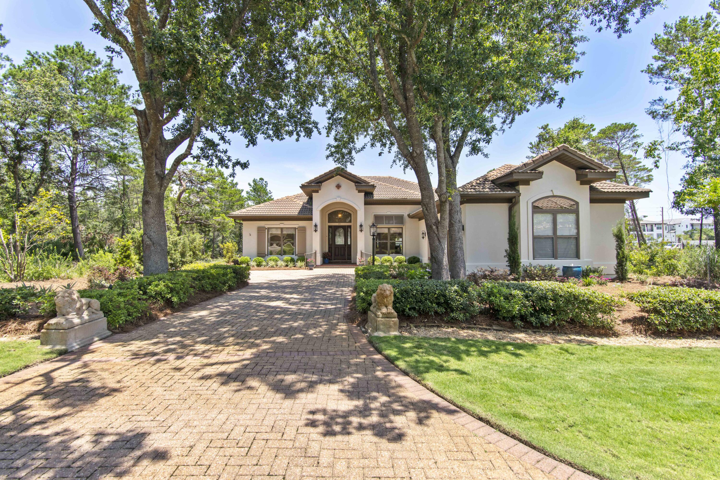 Great opportunity to own a beautiful Mediterranean  home in the exclusive gated community of BellaMar on 30A.  BellaMar is one of only a few neighborhoods on 30A that does not allow short-term rentals.  A dedicated neighborhood beach access is a short stroll away.  This 3 bedroom, 3.5 bath home has a fantastic layout for family or guests.  Beautiful new European Oak hardwood floors have been installed.  The  professional kitchen boasts a 48'' Viking stove and hood, solid surface countertops, a counter-depth refrigerator and is open to a large family room.  The serene master bedroom leads to a huge master bath with a spacious closet.  Two more bedrooms and baths are on the opposite side of the house and can be closed off.  A half bath is tucked out of the way for guests.  The dining room has a beautiful chandelier, cove lighting and a pocket door separating it from the kitchen, perfect for entertaining.  A formal living room offers extra space and privacy.  Oversized screened-in porch leads to a stunning European backyard with an 8-foot wall for privacy and a built-in Italianate fountain.  You'll appreciate the spacious laundry room with sink.  Super clean 2-car garage has  built-in shelving.  There is even an extra bonus room, heated and cooled, off the garage that can be used as a workout room, playroom, office or workshop.  Incredible storage.  Professional landscape lighting and elegant outdoor lighting fixtures are beautiful upgrades.