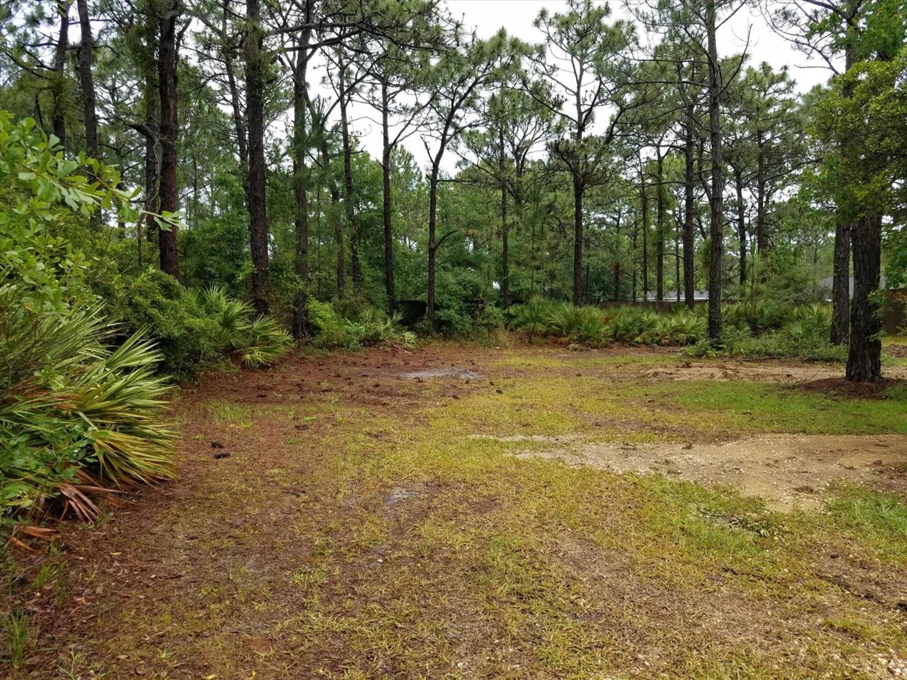 Huge 1.12 acre lot available on a quiet street in Navarre FL. High and dry, no wetlands. Close to beaches and Hurlburt Field. Ready for your dream home or subdivide into two half-acre lots. Power, water and sewer taps are on this lot. Many new homes surround this lot and is waiting on your new home to be built.