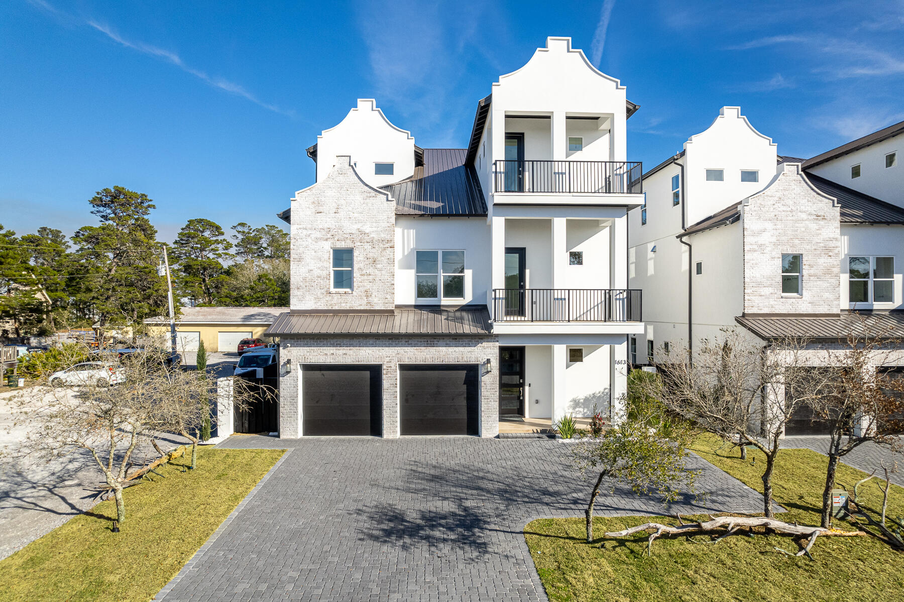 This extraordinary NEW Construction home is a lavish sanctuary mere steps from dining, shopping,and the beautiful white sand beaches. This opulent coastal masterpiece is 3768 sq ft. It has 5 bedrooms and 6.5 bathrooms w/master en-suite bath that has 6 ft tub and walk in shower and custom tile through out. Upon entering the home you will fall in love with the open concept living areas that merge with 6 large outdoor porches which offer Gulf views from elevated vantage points. Large first floor game room which opens to the pool area for extra indoor/outdoor feel. 2 Bunk Rooms 9 total bunks. Each floor has washer/dryer, wet bar, microwave drawer and small fridge.The kitchen/ dining area has a massive island that seats 14 and gorgeous lighting from Restoration hardware. Gourmet kitchen has 48 inch gas stove, 66 inch fridge/ freezer, 2 dish washers and a large pantry. Perfect for those large get togethers. With multiple outdoor balconies and resort style pool with raised hot tub and tanning ledge that connects to a covered lanai area featuring an outdoor summer kitchen. It has grill, grill hood, ice maker, mini fridge and sink which will allows for endless entertaining and relaxation. It also has 6 foot privacy fence, ring door bell, 4 security cameras, 2 car garage with a durable epoxy floor, EV charging station, 6 additional parking spaces. 3 AC units, 3 tankless gas hot water heaters, 2 large owners areas, 8 flat screen tv's, cable and wifi already installed. This house has incredible rental projections available upon request. Hurry ... Now is the perfect time to purchase a fantastic rental property and have it furnished just in time for spring.
