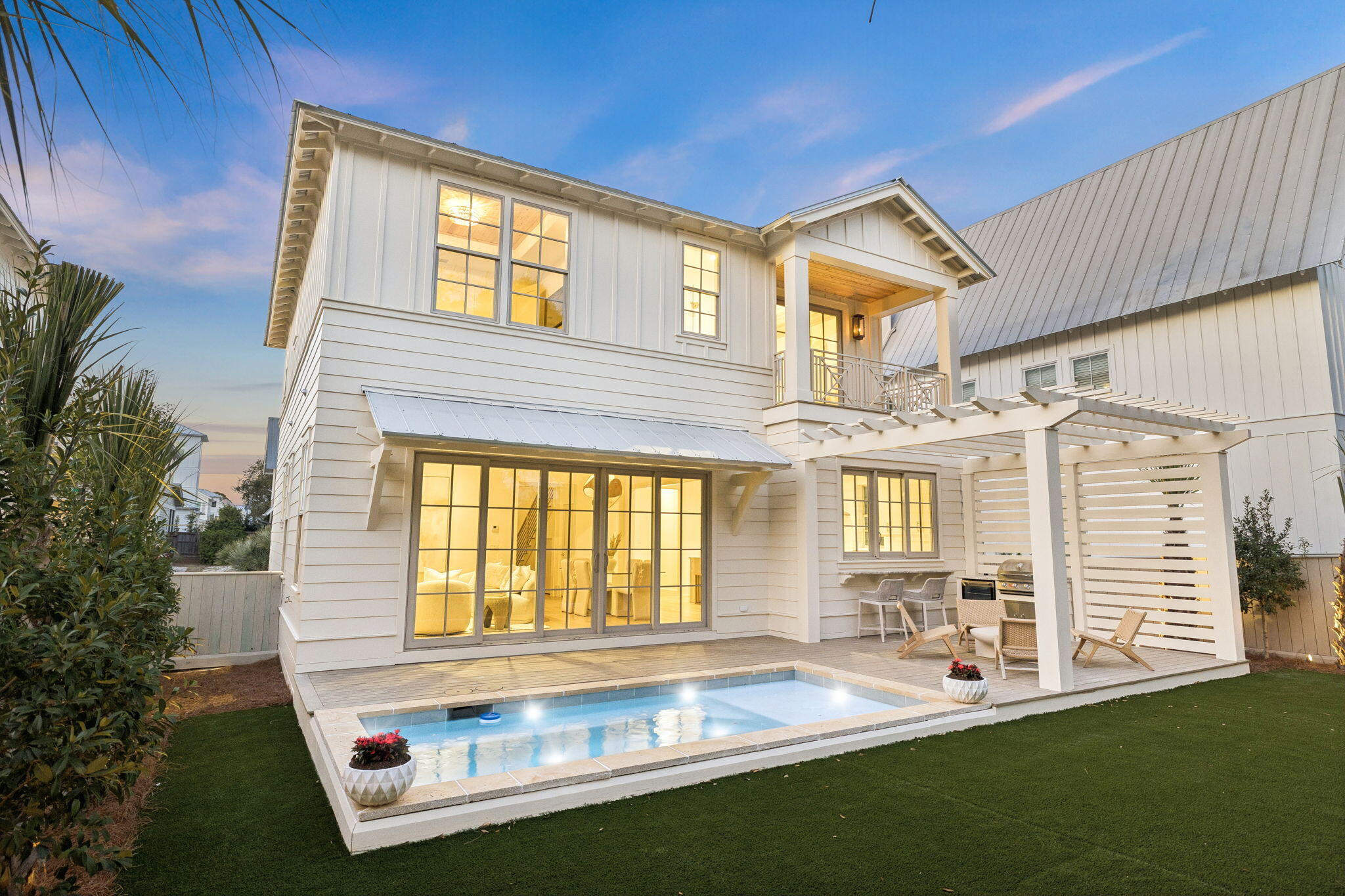 Positioned in the sought-after Preserve at Inlet Beach neighborhood, this newly constructed home by Focus Construction offers 4 bedrooms and 4 bathrooms just minutes from 30A and the Gulf. Built with quality craftsmanship and attention to detail, the home features a functional layout with a first-floor bedroom and three additional bedrooms upstairs, including a spacious primary suite with a vaulted ceiling, private balcony, and views overlooking the pool.

The main living area is designed for both everyday living and entertaining, with 10-foot ceilings, European white oak hardwood floors, and expansive sliding glass doors that open seamlessly to the private pool deck. The kitchen is outfitted with Thermador appliances, custom cabinetry, a large center island, and a walk-in pantry, along with champagne plumbing fixtures and accent hardware. A pass-through window connects the kitchen directly to the outdoor kitchen and poolside entertaining area, creating a true indoor-outdoor living experience.

Outdoor living is a standout, featuring a heated private pool, fenced backyard, artificial turf recreation space, and lush landscaping enhanced by lighting and drip irrigation. A paver driveway and gas lanterns add to the home's curb appeal.

Upstairs, the primary suite offers a private retreat with a balcony overlooking the pool, a well-appointed bathroom, and a spacious walk-in closet. Interior details such as cypress accent ceilings, solid core doors, and custom fabricated handrails highlight the level of finish throughout.

Additional features include built-in bunk beds, a one-car garage equipped with an electric vehicle charger, a gas tankless water heater, and the home is prewired for speakers and security.

Residents of The Preserve at Inlet Beach enjoy private lake access to Lake Powell, a community pool, and a shared dock. With the pedestrian underpass providing easy access to 30A, the Gulf, and nearby dining and shopping at 30Avenue including Amigos, Amici's, Cuvee, Idyll Hounds Proper, and Aja Elevated Asian, this location offers both convenience and lifestyle.

A rare opportunity to own a well-built, thoughtfully designed home in one of Inlet Beach's most desirable communities, just minutes from Rosemary Beach and Alys Beach.