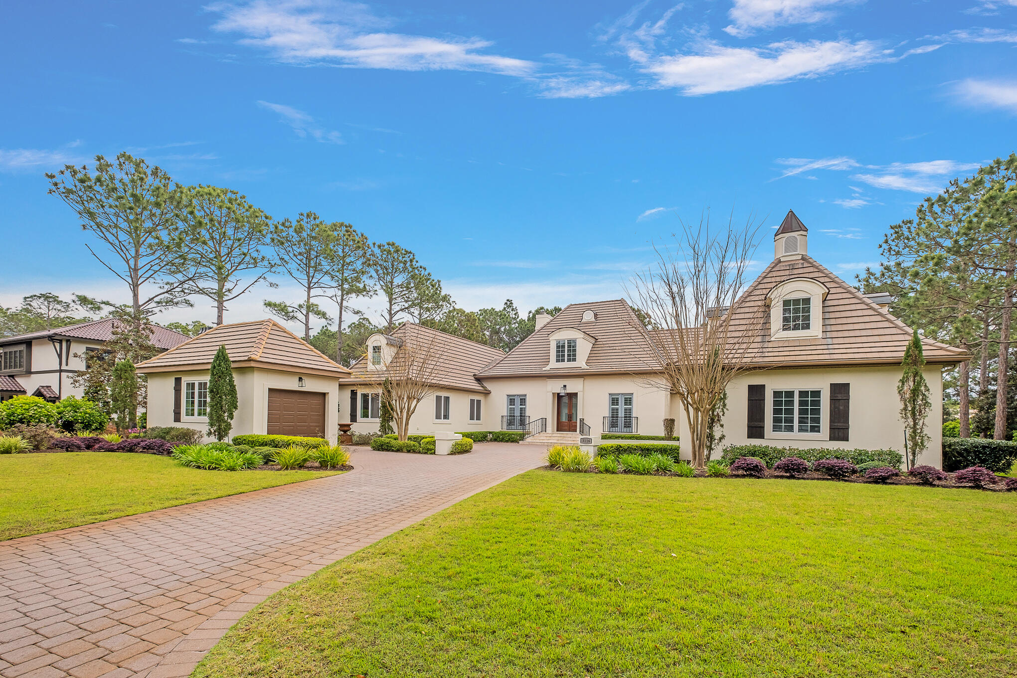 If you seek a secluded estate with stunning views on an oversized lot, this Burnt Pine estate is for you!  Recently renovated, the home features a beautiful living area, a formal dining room, and a gourmet kitchen with new cabinets, counter tops and a spacious family room.  The  master bedroom is truly an oasis with a separate sitting area, a new master bathroom, and a customized master closet.  Every bedroom in the home has a renovated, en-suite bathroom and all closets have been updated.  The covered lanai is perfectly positioned to showcase views across the 10th fairway and lake of the Burnt Pine Golf Club.  Enjoy the heated pool and an outdoor kitchen with a pizza oven.  Additional features include a private workout room, a separate golf cart garage, & a pool bath.  Call today to view! Buyer to verify all dimensions.