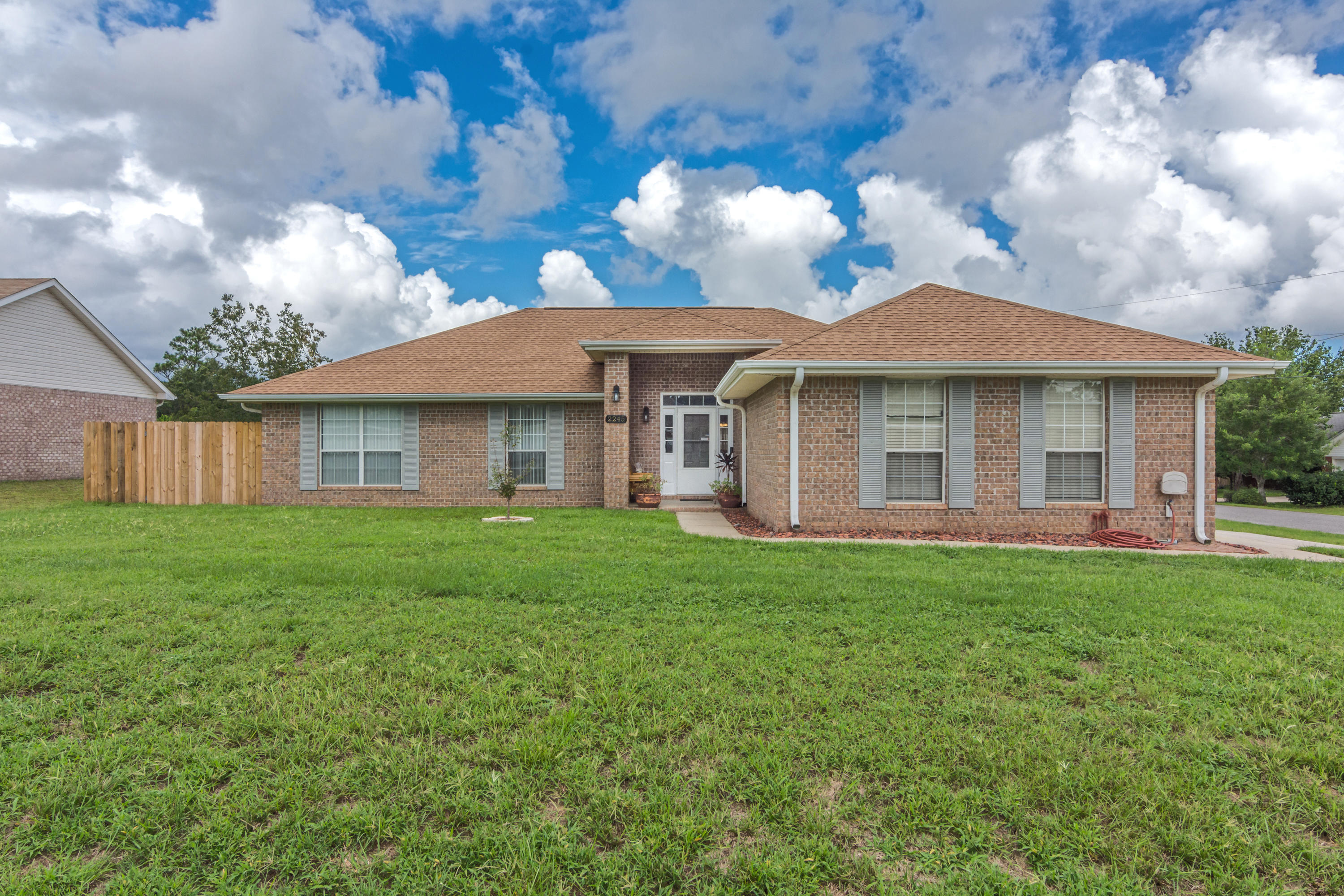 THIS IS THE ONE! If you've been looking for a house with a pool south of I10, THIS IS IT! Beautiful 4 bedroom 2 bathroom home in South Crestview featuring upgraded 18'' tile flooring, wood tile floors, new carpet in bedrooms, NEW HVAC, Ring Cameras installed, covered 24x12 sq. ft. patio, and a POOL with a NEW LINER! Plus, there's a shed with power & water - perfect workshop space! Newly built-out fireplace and a whole house water softener system. This home has so many perks! The garage floor has been surfaced and the entire garage is insulated and comes with an AC window unit, creating a usable space in the garage. And it's all on a quarter acre lot! This home is a MUST SEE!!! PRO PHOTOS COMING SOON!