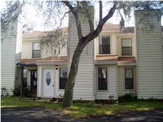 A beautiful townhome tucked away between old majestic oaks. Also, very nice UPDATES to include ceramic tile all downstairs; kitchen appliances, cabinets and countertop, wood blinds; even newer toilets and mirrors... back yard/patio completely cement so no worries about yard work. This is a pet friendly unit - allowing dogs only up to 35 lbs fully grown with non-ref pet fee.