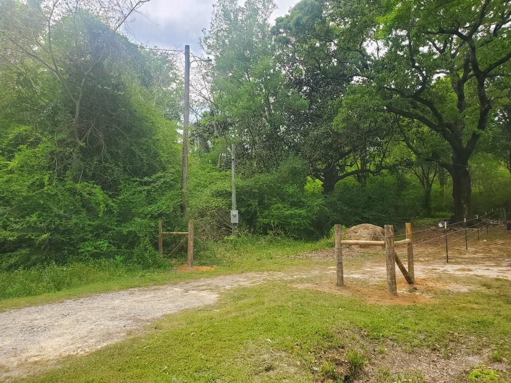 Must See!! This 2 acre lot is located in beautiful Laurel Hill, just a short drive from Lake Jackson. It is equipped with power and a 50 amp connection ready for your RV. Perfect for your stay to overlook your new build, manufactured, or tiny home.  Approximately 1/3 of an acre already cleared. no sign on property. survey available. All measurements are approximate.
