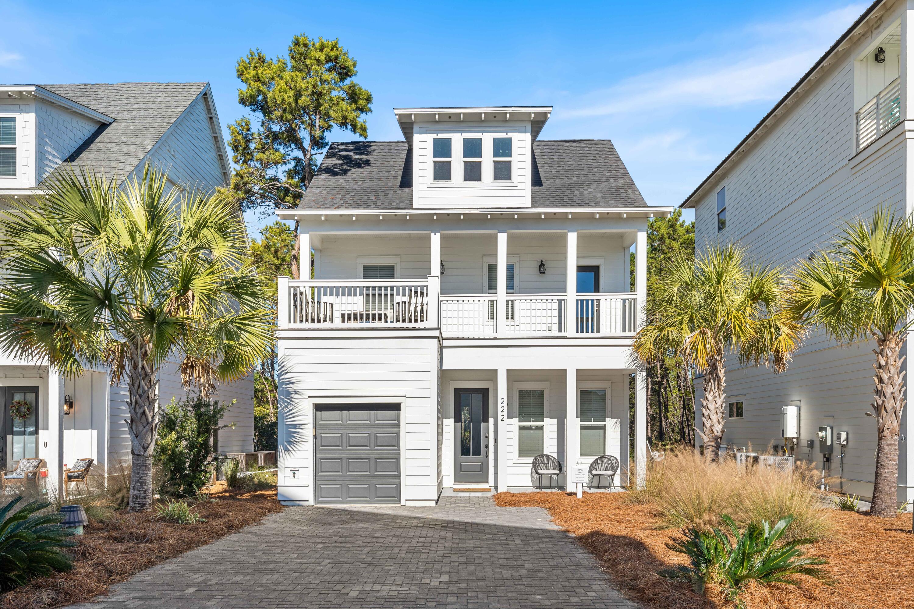 Turnkey short-term rental with a proven rental history of $70,000 per year, located in the Ivy at Inlet Beach. Built in 2022, 222 Valdare Lane offers immediate income potential in one of the most walkable and desirable areas along Scenic 30A. This property is ideal for investors, second home buyers, or those seeking a combination of personal use and strong rental performance.

The home features three bedrooms, two and a half bathrooms, and a flexible layout that comfortably sleeps eight. The open-concept first floor includes a well-appointed kitchen with a gas-burner cooktop, a tile backsplash, and a seamless flow into the living and dining areas. Just off the kitchen is a backyard space ideal for BBQs, gathering around a bonfire, or relaxing after a day at the beach Upstairs, two bedrooms feature ensuite bathrooms, while the third-floor loft includes two double bunk beds, creating an ideal setup for guests or vacation renters. Added shiplap details in the stairways enhance the coastal aesthetic, and a large second-floor outdoor balcony provides an additional outdoor living space rarely found in homes of this size.

Additional features include a hardboard exterior, a tankless gas water heater, a garage for storage or a golf cart, and access to the community pool. The home is truly turnkey and rental ready.

The location is a major selling point. The property is approximately half a mile from Inlet Beach Regional Access, the largest public beach access in Inlet Beach. It is walking distance to 30Avenue with popular restaurants and shops including Amici 30A Italian Kitchen, Amigos 30A Mexican Kitchen, Canopy Road Cafe, Cuvee 30A, Idyll Hounds Proper, and Aja Elevated Asian.

The home is also located next to the new pedestrian underpass, providing easy access to Rosemary Beach, Alys Beach, and all of Scenic 30A. Camp Helen State Park is nearby, and the property offers easy access for biking or walking to the beach, dining, and entertainment.

With strong rental history, excellent walkability, and a prime Inlet Beach location, 222 Valdare Lane presents a rare opportunity to own a high-performing coastal investment in one of the most sought-after markets along 30A.