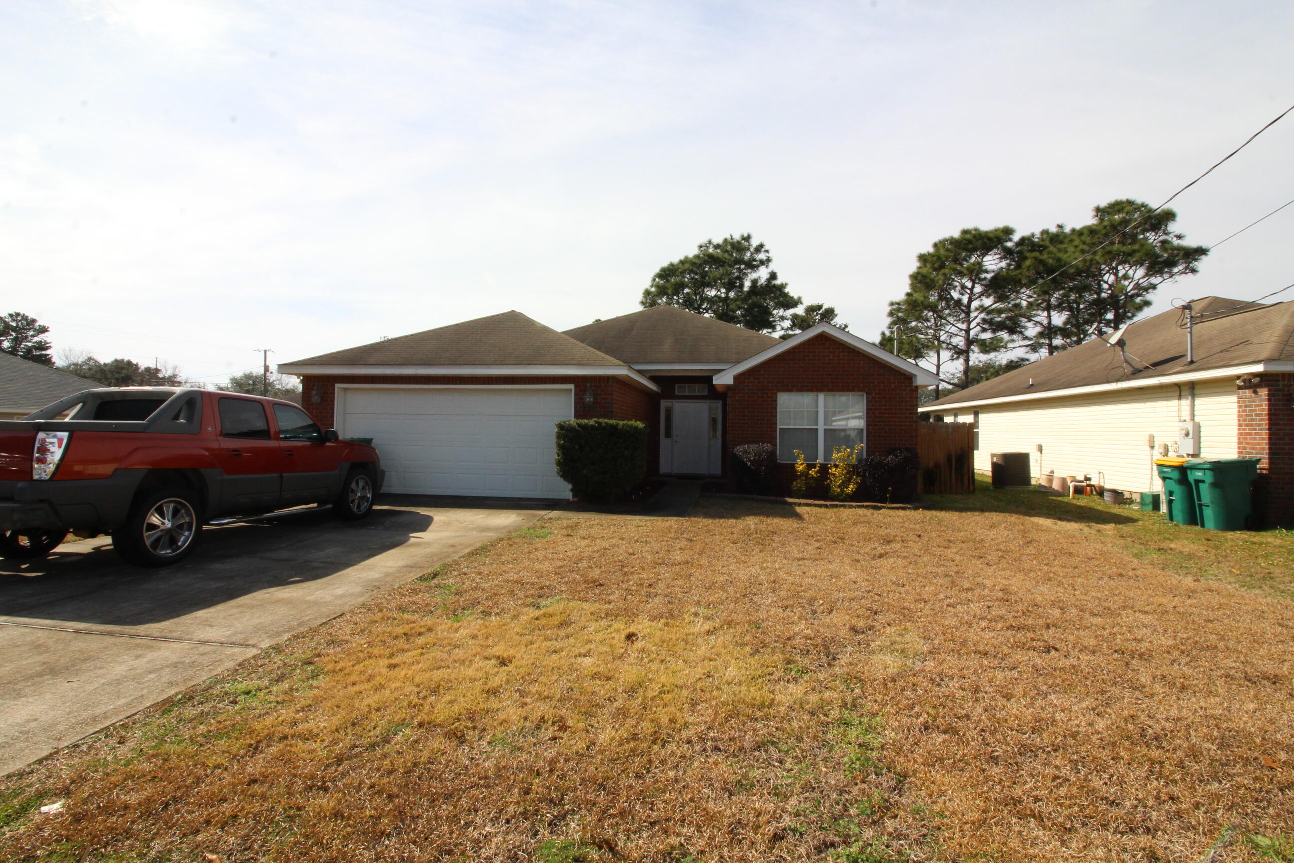 What a Gem! Great Brick Front home is cute as can be with nice curb appeal. Convenient to Hurlburt Field and the beautiful Emerald Coast Beaches. Enter the Vaulted Ceiling Living Room with Fireplace. To the right are the split Bedrooms with Guest Bath. To the left of the Living Room you'll find a Dining Room open to the Kitchen. There is a little Breakfast Bar and a Window at the Sink! Master Suite is spacious with Walk-In closet and Soaking tub. Beautiful Backyard with privacy fence and room for a pool! There is a deck for grilling. 
Great opportunity! Tenant occupied thru Mar 2023. NEW ROOF IN PROCESS OF BEING INSTALLED!!
Buyer to verify all measurements and pertinent information.