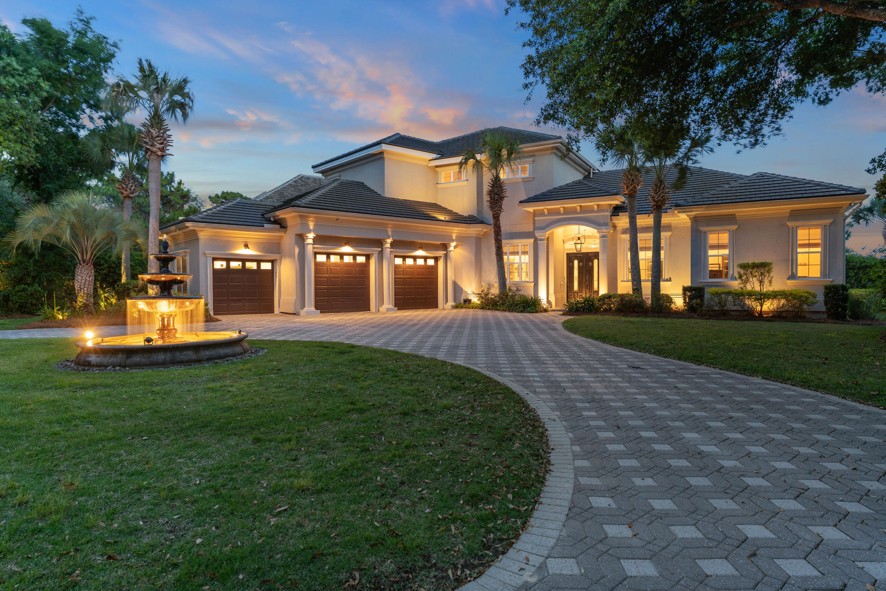Welcome to luxury Destin living at its best! 515 Regatta Bay Blvd is a stunning golf course home overlooking the 15th and 16th holes and lakes in the sought after gated-community of Regatta Bay, one of Destin's premier golf communities that has been named a Golf Digest's Top Places to Play in North America. You will hear the tranquil sounds of the stately fountain as you step through the front doors into the bright, airy, open concept first floor which features 12-13 foot ceilings throughout, crown molding, smart Lutron Caseta lighting and tray ceilings in the living room and primary suite. The custom gourmet kitchen is made for entertaining and is equipped with a Wolf seven burner gas stove, Bosch dishwasher, and a Sub-Zero refrigerator, along with a Scotsman ice maker.  There is ample counter space and cabinets with a large custom pantry area and laundry room, both conveniently located off the kitchen. The large laundry room was recently fully updated with new cabinetry and quartz countertops.  The kitchen opens to the spacious living area, which features a gas fireplace and overlooks the pool, lanai, and the golf course. The downstairs primary suite includes his and her walk-in closets and adjoins the master bath and a flex space, currently used as a workout room.  An office, also currently used as a child's playroom, is located off the living area. The second level hosts 3 bedrooms and 2 baths and provides access to the second-floor screened-in sitting area with impressive views of the lake and golf course.  The current owners have paid close attention to detail, making many upgrades and improvements to the home. Enjoy the peace of mind that comes from a new whole-home 32kW Generac generator (installed in 2021). Additional improvements include:  two new air conditioners and air handlers (upstairs and downstairs), pool replastering with decorative tile, screening-in the 2nd-floor balcony, custom luxury pantry, newly renovated laundry room, and LVP flooring.   The curb appeal is exquisite with lush landscaping, a custom lighted outdoor fountain, and a circular paver driveway. The large garage accommodates two full-size parking spaces and a golf cart parking space. The current owners are also offering several items that may convey with the home if desired by the buyer, including all TVs ( including an 85"Sony, a 75" Samsung Frame TV and outdoor TVs), a 10-foot custom wood dining table with 8 Restoration Hardware chairs, Restoration Hardware bar stools, Restoration Hardware master bedroom furniture set and a 2022 Electric ICON six-seat golf cart, and much more. A complete list of these items is available for review, as is an owner list of improvements. 515 Regatta Bay Blvd is more than just a home, it is a lifestyle facilitated by the many amenities Regatta Bay has to offer.  In addition to the top rated golf course, residents of Regatta Bay enjoy the community pool, kids pool, tennis and pickleball courts, playground and clubhouse. Take your golf cart to the clubhouse for dinner, to the beach for a relaxing day or a short drive to the shops and restaurants of Destin Commons. This is truly a home not to be missed.  Buyer to verify all dimensions.