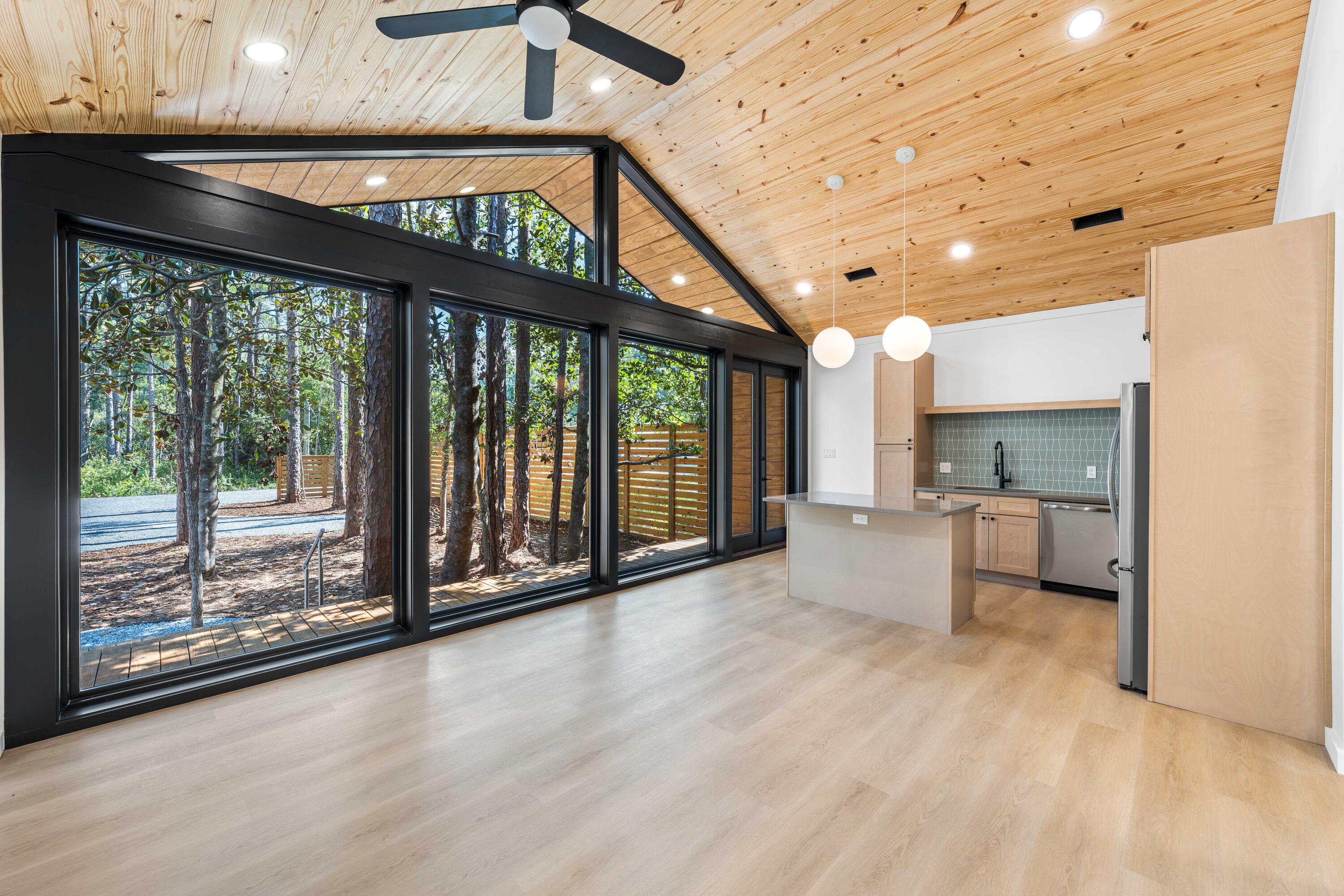 Introducing a New Standard of Living in Santa Rosa Beach, FL This newly completed residence offers a fresh take on modern living, blending clean architectural lines, natural textures, and abundant natural light. Designed with simplicity and function in mind, the home features a bright open-concept layout, vaulted ceilings with wood tongue and groove detail, and expansive Anderson windows that create a seamless connection between indoor and outdoor spaces.

Inside, you'll find durable luxury vinyl plank flooring and matching stainless steel appliances that bring both style and practicality to the heart of the home. The primary suite includes a full ensuite bathroom and a spacious walk-in closet, offering a quiet and private retreat. A second bedroom and full guest bath provide flexibility for guests, family, or a home office setup. Step outside to enjoy the fenced yard with natural landscaping, along with a spacious outdoor deck, ideal for entertaining or unwinding in the fresh air. Move-in ready and thoughtfully designed, this modern home offers the perfect balance of comfort and clean, coastal style in the sought-after Santa Rosa Beach community. Located just 10 minutes from the beach and the shops and dining of Gulf Place on 30A, and only 3 minutes from the Cessna Landing boat launch on Hogtown Bayou, you'll enjoy convenient access to both water and lifestyle amenities that make this area so desirable.