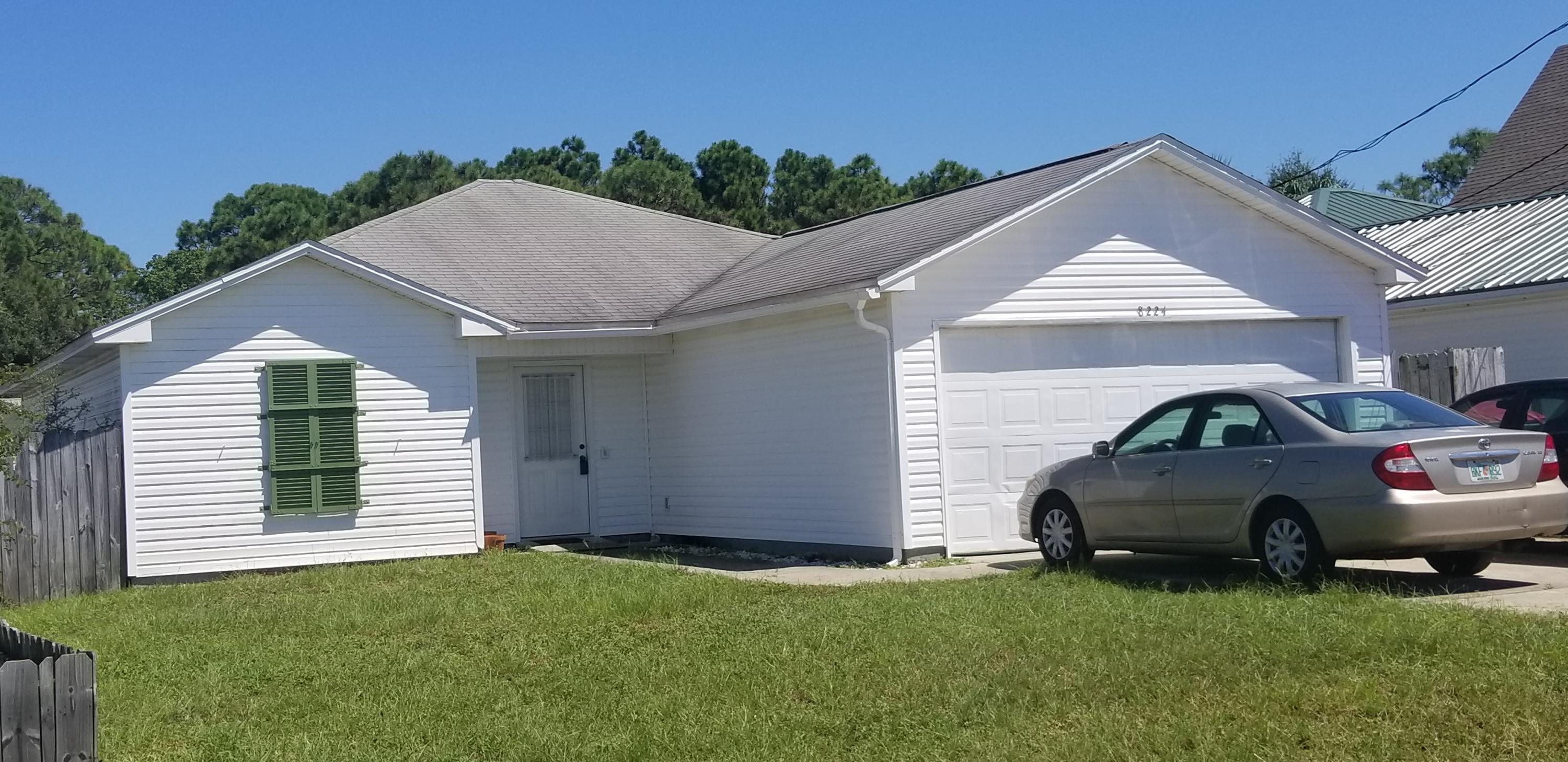 Unique opportunity to own a home within blocks in Panama city beach! This 3 bedroom, 2 baths home offers a large eat in kitchen with a free season room two steps away. The master suite has an exceptionally large bedroom, spacious walking closet, with accommodating full bathroom. The master suite offers privacy from two additional bedrooms on apposing side of the house. A full bath services both bedrooms and its located steps from the living room. 2 car garage makes it easy to unload groceries to the kitchen. Laundry room is located centrally in the home. This home has it all for a family looking to be in a heart of Panama City Beach without breaking the bank.