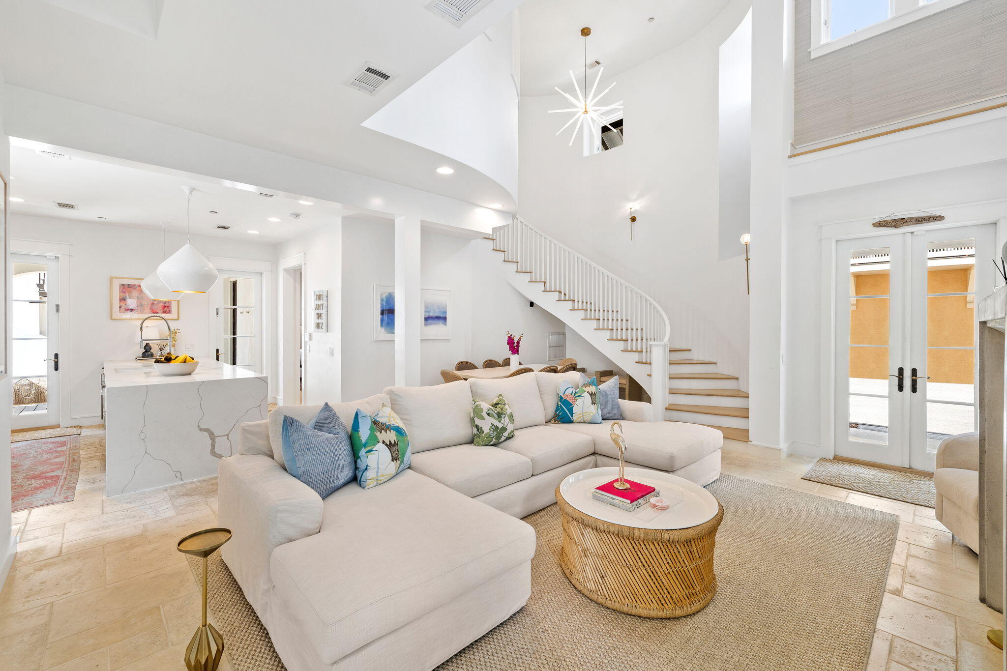 This generous corner lot in the renowned community of Rosemary Beach boasts a main house, carriage house, 2-car garage, pool and a spacious courtyard with outdoor fireplace. The home borders West Kingston Park, a lush picturesque area to enjoy relaxed summer evenings. 

Step into the soaring living room filled with natural light anchored by a contemporary fireplace. Living opens to the dining area and the updated gourmet kitchen with waterfall Cambria quartz counters, Sub Zero and Wolf appliances, and professionally designed pantry. A spacious bedroom with en suite bath on the main level opens to the covered porch and show-stopping courtyard. Distinctive designer lighting, grasscloth wallpaper and new furniture are a few highlights of the home's fresh interiors. The second floor, accessed by a sweeping stairway, hosts the king primary suite with private porch, a king guest bedroom and bunk room, a cantilevered study and a bonus living space overlooking West Kingston Park. The back porch of the main house leads to the courtyard featuring the large saltwater pool, outdoor fireplace, summer kitchen, water fountain and three outdoor living spaces. 

A private entry to the 2-story Carriage House allows guests autonomy during a visit. One of the largest carriage homes in Rosemary, guests enjoy a living room, full kitchen, a king bed, 2 queen beds, a twin bed, and full and a half bathroom, providing comfortable lodging for up to 7. The carriage house has porches overlooking the courtyard and a washer and dryer providing the utmost in functionality and convenience. 

This legacy property is being offered fully furnished with a small list of exclusions available upon request.
