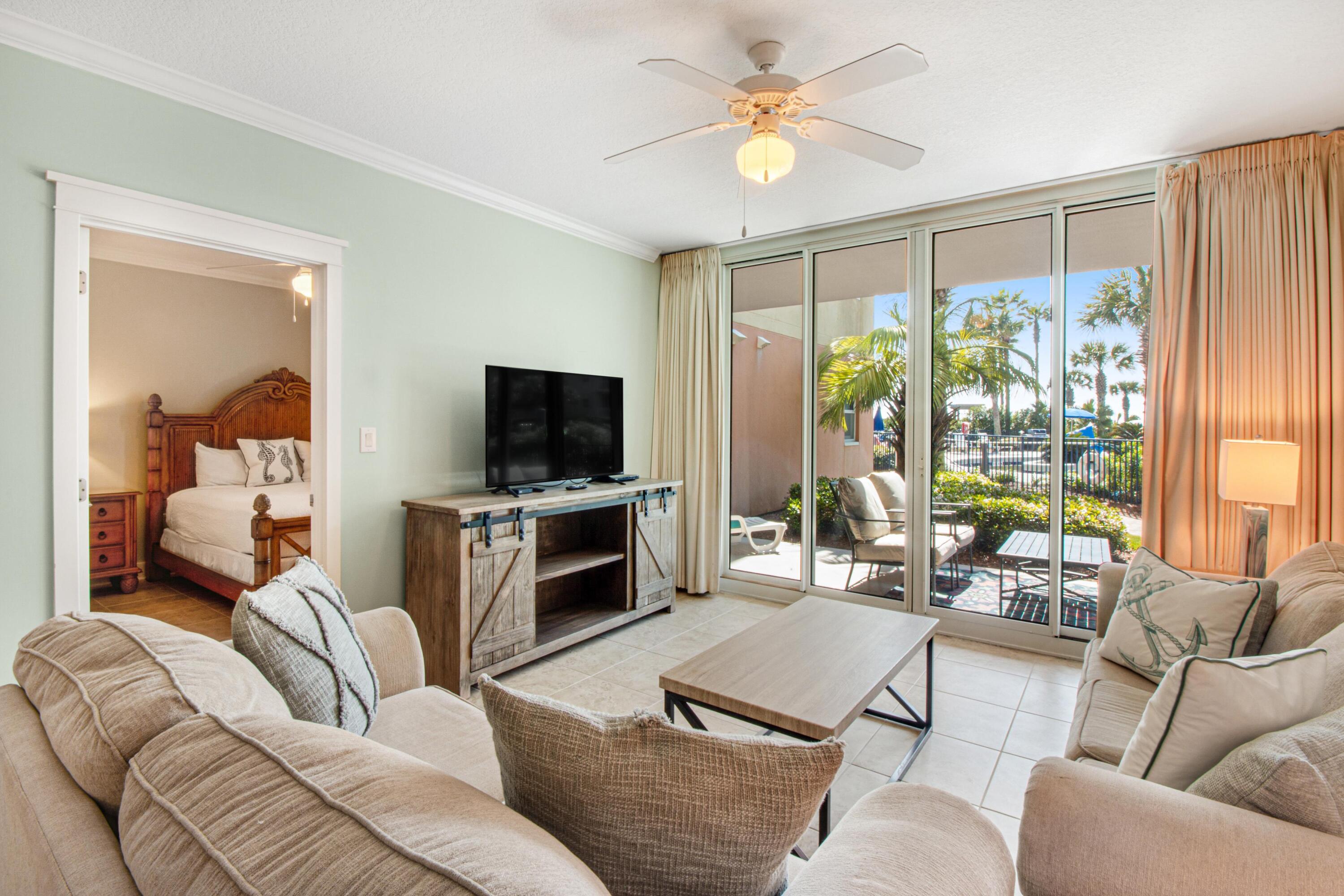 The pinnacle of Gulf front living, this stunning 2 bedroom, 2 bath condo in A building at Waterscape is truly deserving of the term masterpiece. Imagine one of the area's most luxurious condominium complexes with every amenity desired including 490 feet of pristine beach front. This first floor location is very convenient as you can  walk straight out to all of the amenities without having to wait or take an elevator. The condominium's kitchen is well appointed with granite countertops, stainless steel appliances, tiled floors throughout the entire condo, and furnishings that reflect a coastal feel that we all love here at the beach! The remarkable courtyard features 3 pools, 2 hot tubs, waterfall and a famed Lazy River that you have to see to believe! There is also a Children's play area with splash pad and water activities, game room, BBQ grills, conference facility, fitness center, and covered garage parking.
