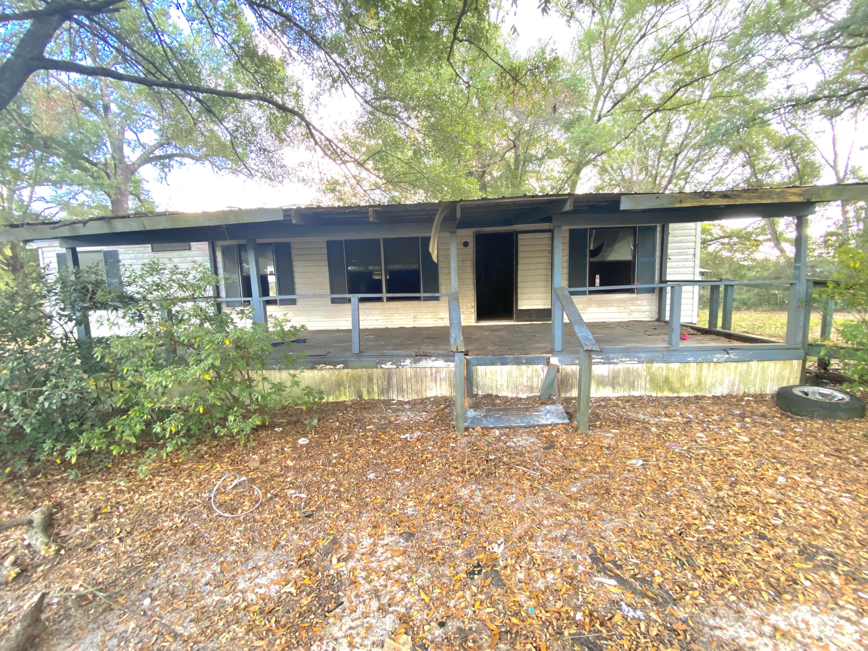 Handyman special 1700 sf  home on .84 acres 
includes well septic and power diamond in the rough