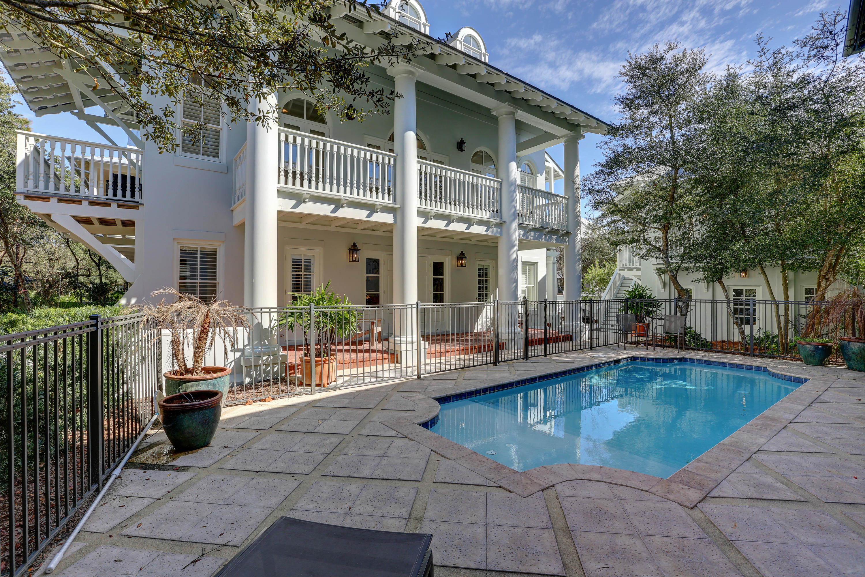 Major price drop! All new living room and kitchen furnishings added in April 2019, new 3rd floor furnishing in Sept 2019. Privacy abounds in this 3 story, all stucco home & carriage house south of 30-A, in Rosemary Beach. A large, heated pool along with separate patio with fire pit and grill, provide plenty of space for outdoor enjoyment. Entering through the front, bricked & columned porch is reminiscent of New Orleans grand plantation homes. The first floor houses the large, master suite complete with recently renovated bathroom. Bunk room with 4 beds, plus another bath and laundry room, complete the first floor. Ascend the curved grand staircase to the second level living area - kitchen, dining and living. Evenings will be spent dining al fresco on the spacious second level balcony! 2 additional balconies span the width of the home on both the west and east side.  Renovators note the potential of enclosing those side balconies to increase the square footage. The 3rd floor offers another bedroom with large private bath.

Above the 2 car garage is a 2 level, 778 sqft, carriage house.  The first level houses a full living room, full sized ktichen and bath. Up the stairs and you will find a large, light and bright bedroom.  

A 2 minute walk to the beach and 1 minute walk to the tennis courts, contribute to the perfect location!  A few minutes further and you are in the town center with your choice of 10+ restaurants and many shops.  Stroll through the boardwalks to truly experience Rosemary Beach!   Rental projections of $170K/year from Rosemary Beach Cottage Rentals.

Information contained within this listing such as square footage, is deemed to be accurate but is not guaranteed. Buyer to verify