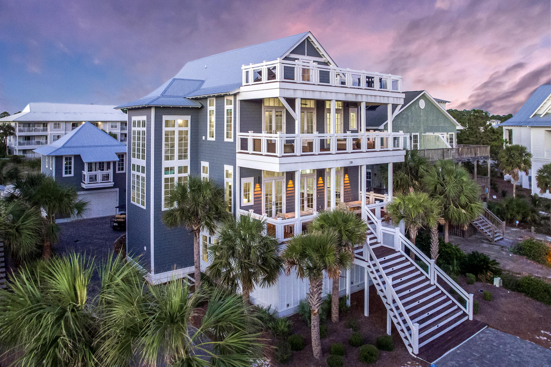Take your morning coffee to a new level, Sea Level! 
An era defining estate sized beach house, this dazzling beach retreat offers every possible amenity with plenty of room for friends...36 friends!  This 9 bedroom, 4 story home offers sweeping views of the Gulf of Mexico with terraces from every floor to lounge the day away. 
The easy living floor plan starts on level I.  Two large bunkrooms designed to each sleep eight, both outfitted with personal TV's in each bunk and ensuite baths, open to a cozy living room flanked with a side game room for a game of pool or air hockey.  Sliding glass doors open to a grand scale outdoor terrace, summer kitchen, living room with flat screen TV and a salt-water, heated pool and spa that features a TV to watch while you float the day away in the pool.