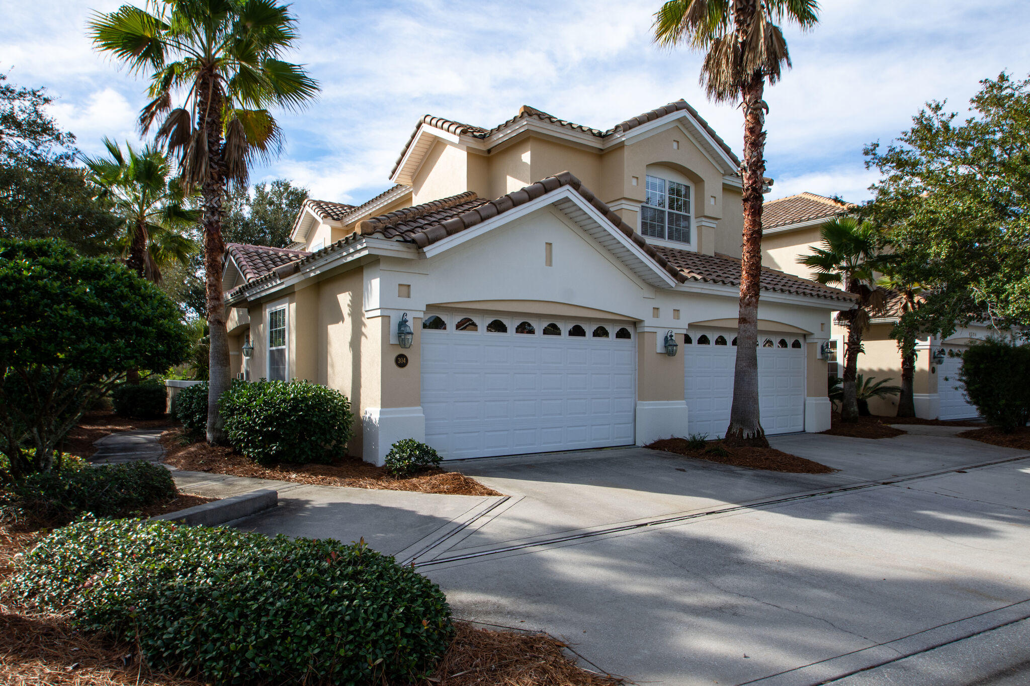 Pristine unit at Regatta Bay Golf Villas!  Move-in ready!  Spacious second level residence features a functional, open floor plan, nicely appointed with tile floors, granite counters, stainless appliances, crown molding and more.  Split bedroom floor plan, with a luxurious master suite, two guest bedrooms (one of which is oversized and could also be a den), two guest baths.  Lovely screened porch overlooking the #3  green.  This unit also has a two-car garage.  Enjoy the amenities center with pool, tennis courts and playground.  Regatta Bay's Golf Course is top-rated, has a wonderful clubhouse and restaurant.  You're just a short golf cart ride away from Legendary Marina and all the shopping, restaurants and special events at Destin Commons. Priced to sell!