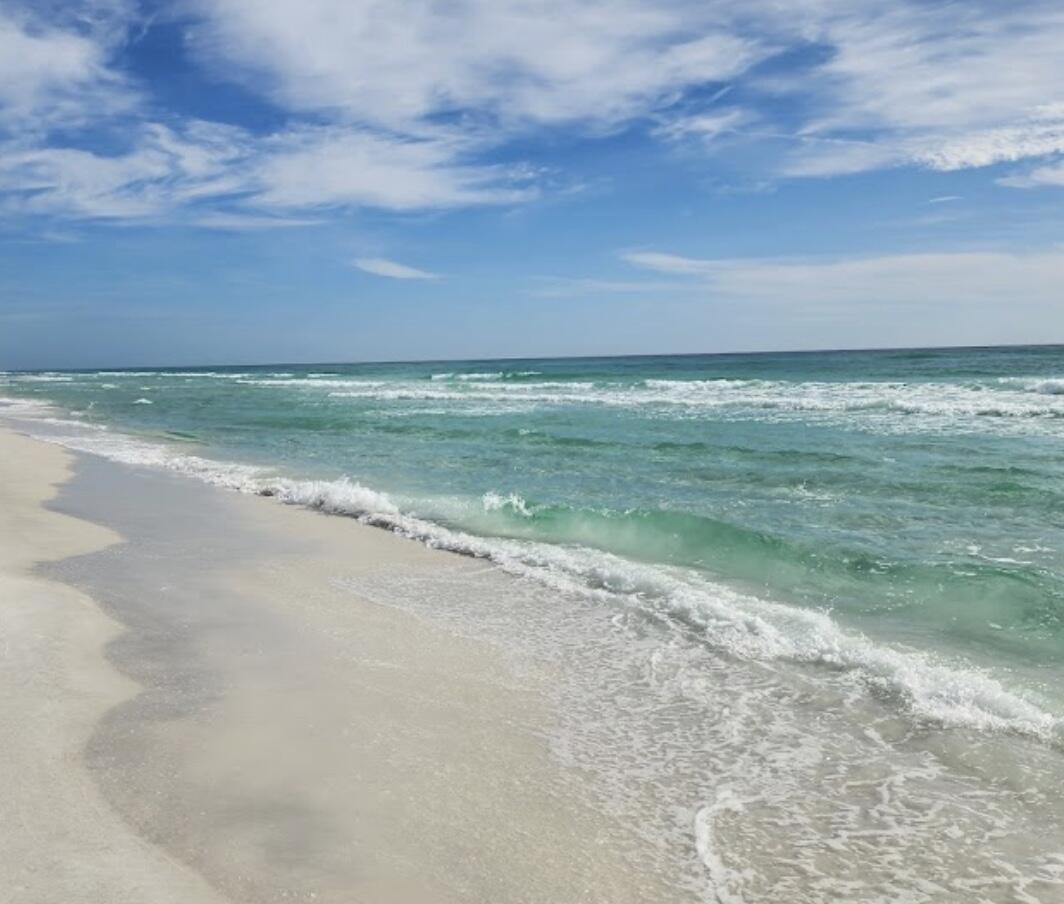 Build your dream home here! This is a rare lot south of 98 and within minutes of the Gulf and all 30A has to offer!  A quick bike or golf cart ride away from Emerald Green waters and white sandy beaches! Multiple beach accesses and Santa Rosa Rosa Golf Club are just a few minutes away! Lot has access to city water, sewer, electric, and is in X flood zone (high and dry). Live the golf cart life!