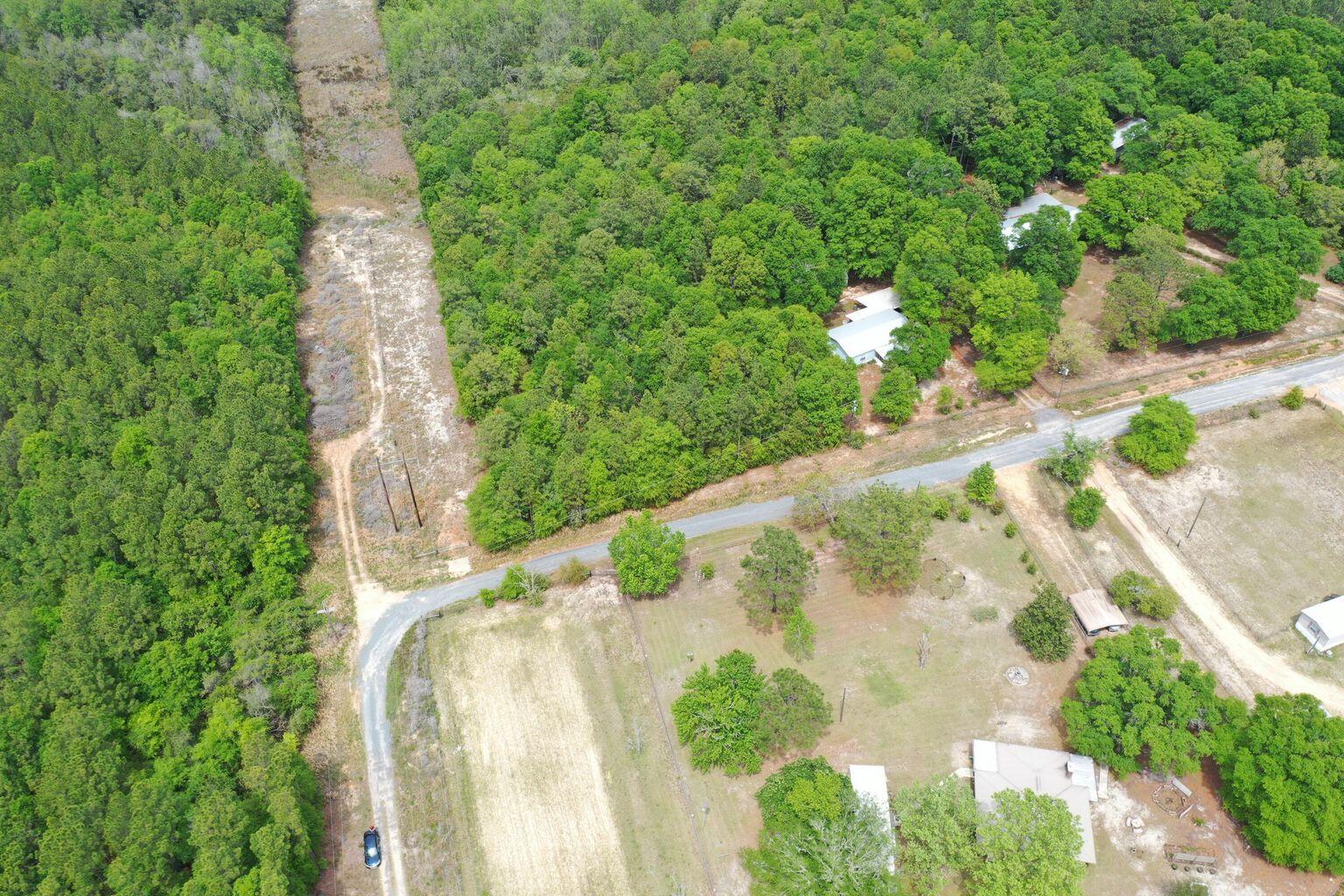 This beautiful piece of land would make an amazing homesite Or a great place to take the camper to get away for the weekend!  The beautiful wonders of nature abound this property, it is simply A nice piece of dirt located just North of Crestview close to restaurants, Theaters & recreational parks!  Location is everything!  This is the perfect Location to build your perfect home AND at a PERFECT PRICE!