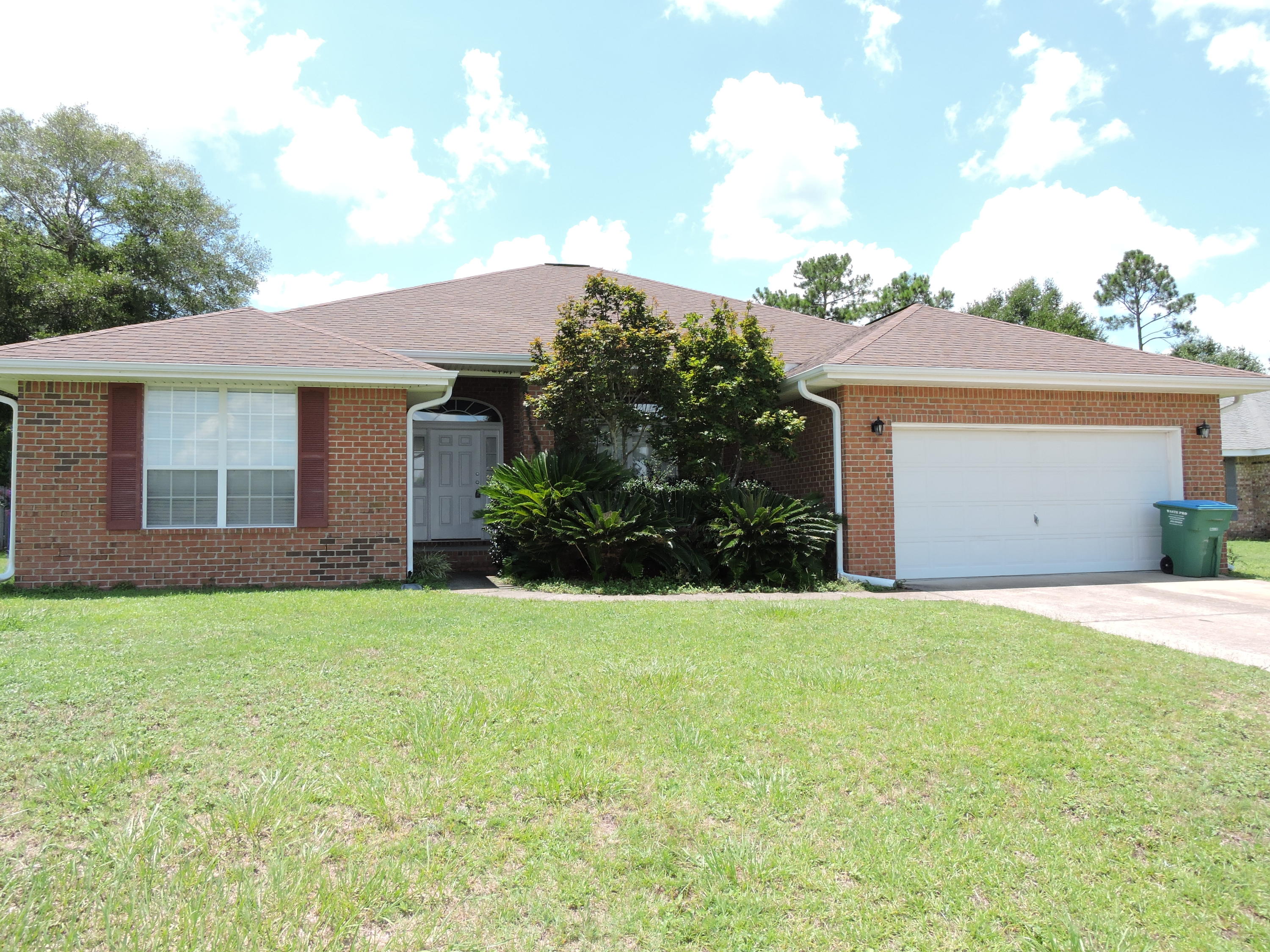 SOUTH OF I-10!! Great location- close to all military facilities, hospital, shopping, beaches, I-10 etc!! This 4 bedroom/2bath, 2327 sf home features split bedroom design, large open family room with fireplace, formal dining, plant shelves,kitchen/breakfast combo, pantry, plenty of cabinet & counter space, great master suite with separate shower, whirlpool tub, double vanities & large walk-in closet. Carpet in bedrooms only- laminate wood flooring in family, dining, hall - tile in wet areas. Privacy fenced back yard with open patio completes the home.*** NON-SMOKERS. SMALL PET MAY BE CONSIDERED WITH OWNER APPROVAL ***. CALL TODAY & SET YOUR APPOINTMENT!!