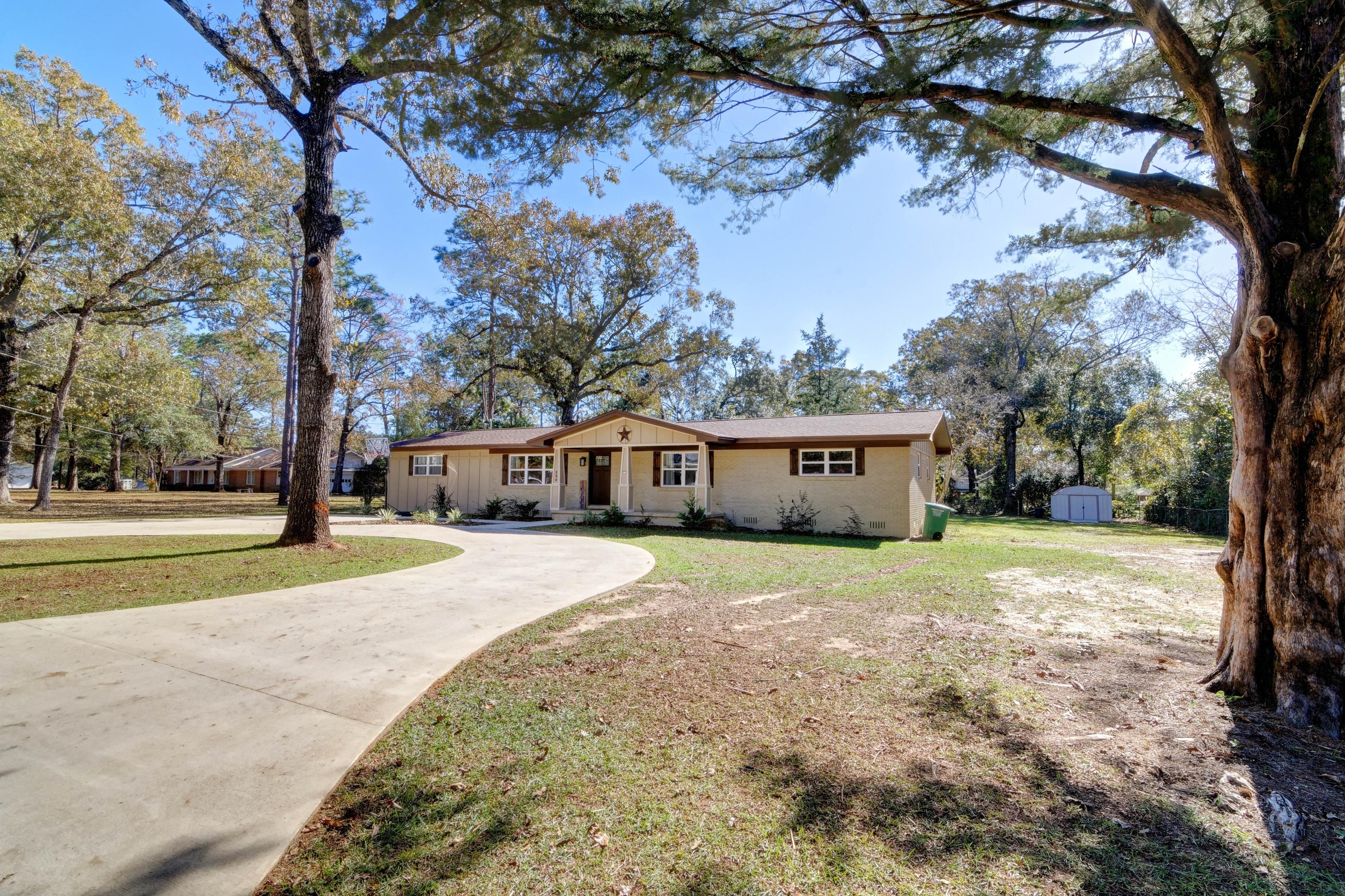 Welcome to this COMPLETELY remodeled (inside and out!) 4 bedroom, 3 bathroom home on a fantastic 0.44 acre lot! From the time you drive up into the massive circled driveway you'll fall in love with this charming home. Remodeled in 2019 to include all new windows, new interior and exterior doors, new plumbing, new electrical, new room, new appliances, HVAC, etc you will have peace of mind knowing you're getting a better than new home! Enter inside and appreciate the laminate wood flooring that extends throughout with tile in all the wet areas. Granite countertops grace the recently remodeled kitchen with all new cabinetry, appliances, and a deep kitchen sink. Enjoy a massive master bedroom (check out the barn doors!), and three other spacious bedrooms. The back bedroom even features it's own full bathroom. All bathrooms feature the same quality finishes with granite counters, quality tile floors, and bronze finishes. Step outside to the backyard where you'll love to entertain! The back deck is the perfect place to relax, or walk down to the firepit where you can enjoy Florida evenings with your family and friends! You don't want to miss out on this gem where you can have a convenient commute to the 7th Special Forces Group and Eglin AFB. No HOA!