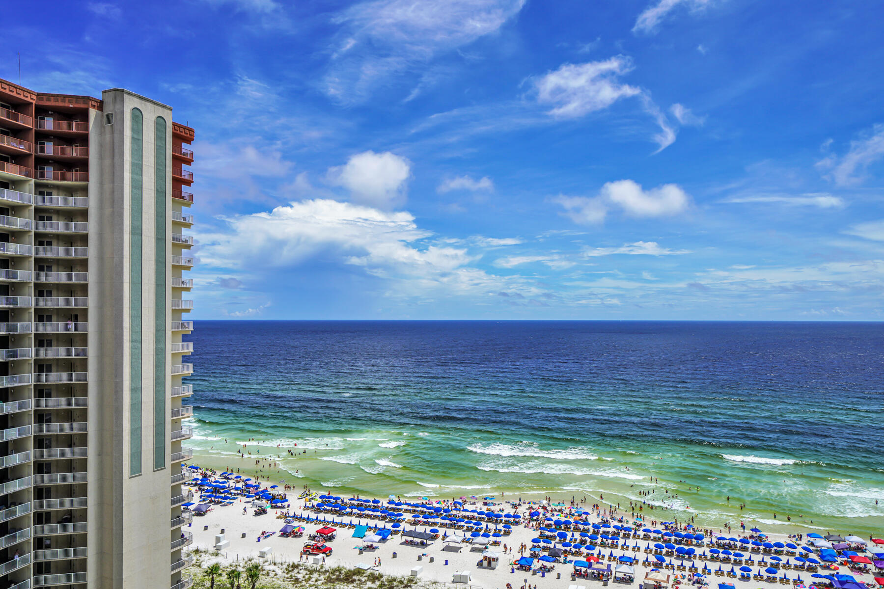 Gulf Front fully furnished 1 bedroom plus bunk room w/ 2 full baths Condo in the popular Shores of Panama Beach Resort. The C(L) floor plan is one of best in the complex and features gulf views from the living room, kitchen, and master bedroom. A deeded parking spot on the 9th floor (marked Reserved for unit 1513) is located by the elevator entrance making it convenient to access the unit with luggage and groceries,  Enjoy sunrises and sunsets from the large balcony spanning the entire width of the unit.  Similar units in this complex gross between $35k and $45k a year. Resort style amenities include a Gulf side pool and hot tub, large heated indoor pool and hot tub, health and fitness center, spa, sauna, massage therapy, steam room and Kid's Club. Two tiki bars serve lunch and dinner.