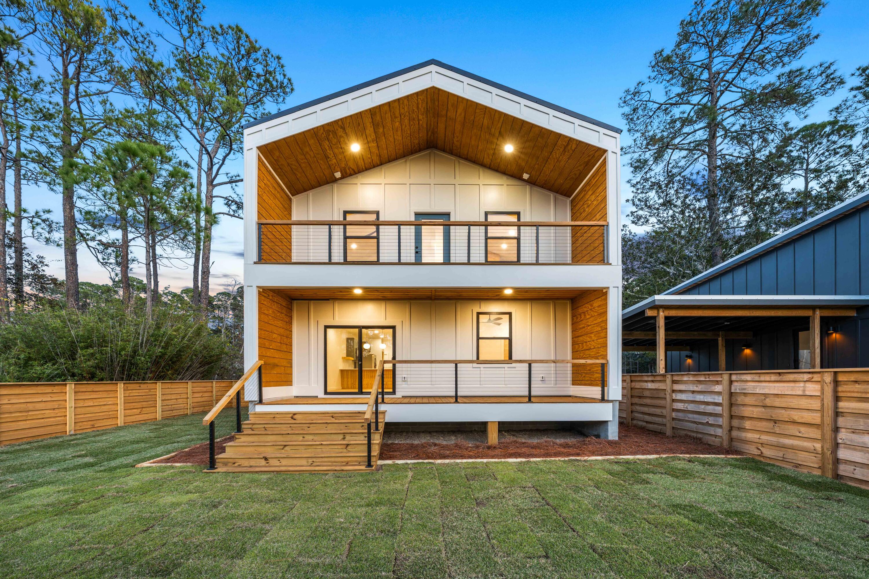Waterfront living under $600K in Santa Rosa Beach is almost unheard of. This modern coastal home offers direct access to Hogtown Bayou and features a layout designed for flexibility, rental income, multigenerational living, or smart house hacking.

Built by Sunset Homes, the residence is thoughtfully designed across two fully self-contained levels, each functioning as its own private living space with separate exterior entrances. This setup creates a rare opportunity for dual living, long-term rental income, short-term rental potential, or owner-occupied investment strategy.

The lower level includes a full kitchen, living area, private bedroom, full bathroom, and dedicated laundry. Upstairs, you'll find two bedrooms, a full bathroom, a second full kitchen, laundry, and an open living area that flows onto waterfront balconies overlooking Hogtown Bayou. With two independent units under one roof, buyers can live in one unit and rent the other, lease both units for cash flow, or accommodate extended family with privacy.

Step outside and enjoy the kind of waterfront lifestyle buyers along 30A are always searching for. Launch a boat, canoe, or kayak directly from your backyard and cruise the bayou with ease. Two exterior balconies face the water, creating ideal spaces for morning coffee, sunset views, and relaxed coastal evenings.

The fenced and sodded yard, concrete driveway, and one-car garage with lockout and separate exterior entry add another layer of convenience and privacy, further enhancing its investment appeal.

Finished with Anderson windows, a Hardie board exterior, tile kitchen backsplash, and a modern contemporary design with coastal flair, this home balances durability, style, and low-maintenance living.

Located just down the street from the Cessna Landing boat launch and park, and minutes from Gulf Place, Ed Walline Beach Access, and popular local spots like Shunk Gulley, The Perfect Pig, Papa Surf Burger Bar, and Shelby's Beach Bar, the location delivers both waterfront serenity and everyday convenience.

Whether you are searching for a primary residence, a second home, a long-term rental, or an income-producing duplex-style investment property, this is a rare opportunity to secure waterfront real estate in Santa Rosa Beach at a price point that continues to shrink along 30A.