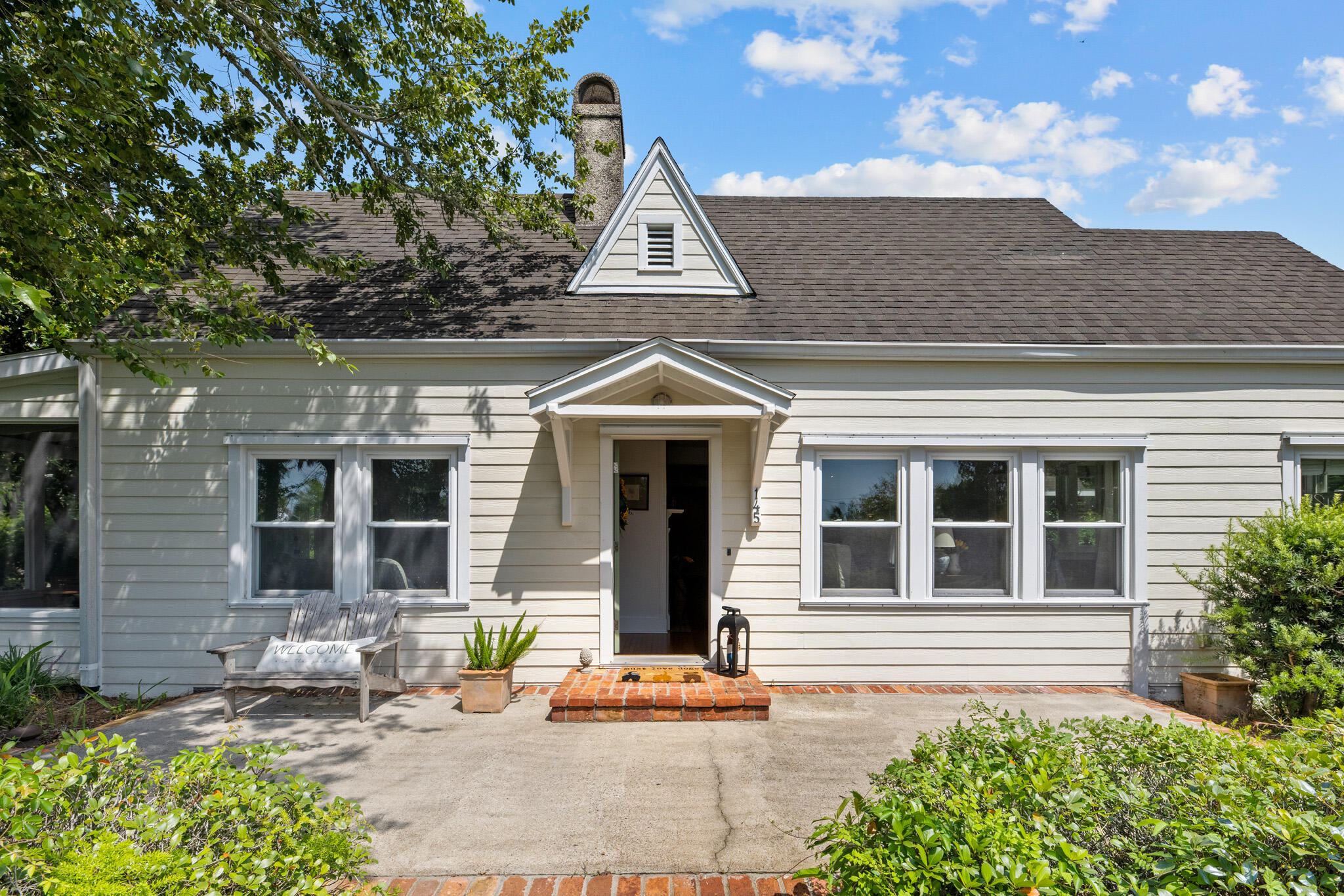 Motivated seller! Huge Price Improvement!!!
Welcome to 145 Bay Avenue - an authentic Florida cottage nestled in the heart of Apalachicola's Historic District. This charming 2-bedroom, 2-bath home sits on a spacious 1/3 of an acre lot just steps from the Apalachicola Bay and a short walk to downtown shops, restaurants, and waterfront parks. Inside the home, you'll find heart pine floors, gorgeous bay views, and vintage touches throughout. The living spaces are light and bright, with large windows that bring in the coastal breeze. The updated kitchen offers modern convenience while keeping the character of the original home intact. The guest bedroom shares a full bath, while the Primary suite includes a private bath and sitting area that opens to the side porch. porch with bay views or gather with friends in the backyard shaded by mature oaks. The oversized lot provides room to garden, expand, or even add a guest house (with city approval). A spacious carport offers covered parking with a separate workshop with running water and electricity. Whether you're searching for a full-time residence, weekend getaway, or investment opportunity, this lovingly maintained home offers the ideal blend of location, history and charm. Don't miss your chance to own a piece of Old Florida just a stone's throw from the bay.
