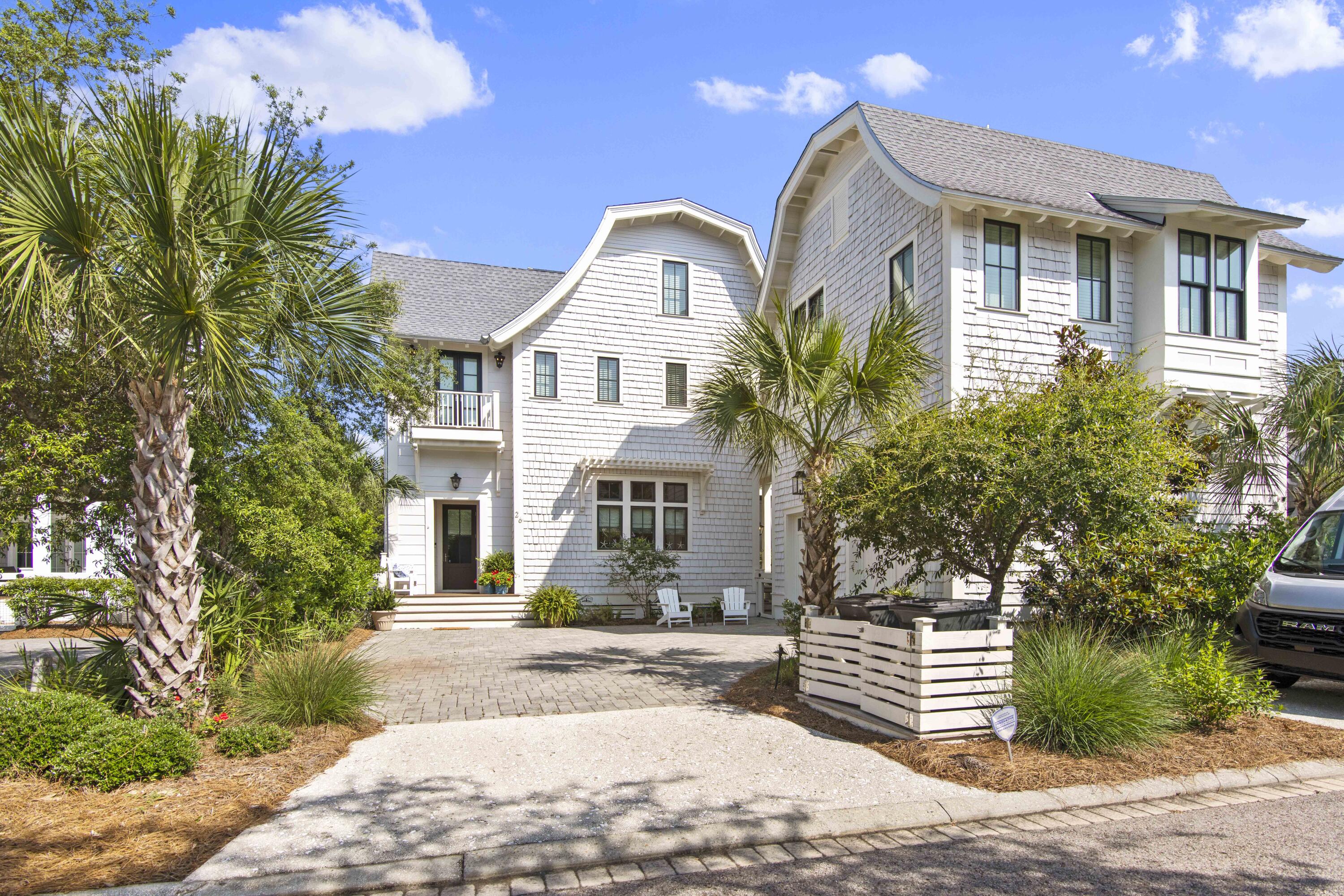 This magnificent newly built estate is a true masterpiece of craftsmanship and design. Located within the highly sought-after WaterSound Beach community, this property offers the ultimate in luxury coastal living. Nestled on a larger lot at the edge of an expansive green space and pond, this estate offers privacy and tranquility, while still being within walking distance to the private beaches and dunes of WaterSound. The home features six bedrooms spread between the main house and the carriage home - three of which are master suites, providing ample space for family and guests. In addition, there is a lofted room that can be used as an additional sleeping area. One of the standout features of this property is the viewing tower, which offers breathtaking views of the park & Gulf of Mexico The outdoor spaces of this estate are simply phenomenal. The heated private pool with hot tub and water feature is the perfect place to cool off on a hot summer day. The pool deck and two porches provide ample space for lounging and entertaining, while the master balcony offers a quiet retreat with stunning views.

Inside the home, the craftsmanship and attention to detail are evident throughout. The 12-foot ceilings and wooden beams create a sense of spaciousness and grandeur, while the shiplap walls and custom built-in's add warmth and character. The open floor plan allows for a seamless flow between the living, dining, and kitchen areas, making it ideal for entertaining. As you enter the home, you are greeted by the warm glow of gas lanterns and an elegantly decorated grand foyer. The home offers an incredible open living area and a formal dining area that exudes elegance. If outdoor dining is more your style, there is a fantastic added screened-in porch with a grill perfect for enjoying meals outside. The interior Chef's kitchen is a true masterpiece, with an oversized Quartz island that is perfect for casual dining. The kitchen features custom cabinetry, a farm sink, and top-of-the-line appliances including a SubZero fridge, an 8-burner Wolf range, dual dishwasher, wine fridge, and ice maker.

The first floor of the home is where you will find the spacious master suite, complete with a stunning master bathroom featuring double vanities, a marble shower, and a soaking tub. There is also a guest quarters downstairs, a half bath, a laundry room, and a mudroom. The second floor is where you will find two additional master suites and a guest bedroom each generously sized with ensuite baths, custom curtains & plantation shutters and walk-in closets. There is also a spiral staircase leading to a lofted area with a queen bed and another full bath and laundry room nearby. The upper living area boasts 17-foot barrel-ceilings and access to an incredible covered porch, perfect for relaxing or entertaining.

The third floor of the home is where you will find the viewing tower, which offers panoramic views of the Gulf of Mexico and the surrounding green space. The elevator goes all the way up to the third floor, where you will find a wet bar and easy access to the tower - ideal for catching the sunset with a glass of wine. 

The one-bedroom carriage house is perfect for guests or extended family and has raised ceilings and a full bedroom and bath. The home is impeccably maintained and has many custom features, making it a true gem within the WaterSound Beach community.

WaterSound Beach is an exclusive beach community with seven miles of boardwalks and walking trails connecting community pools, a children's park, a puttering green, and a dog park. The beach boardwalk meanders through breathtaking dunes, bringing you to paradise. This home is also close to the golf cart beach path and additional wooden walkway, making it an ideal location to enjoy all that WaterSound has to offer. There is a community pool close by and you have the option to join the coveted WaterSound Beach Club as well. Enjoy the nature trails, Deer Lake State Park, and one of the rare coastal dune lakes for fishing, kayaking, or paddleboarding. Don't miss out on this incredible opportunity to own a custom newly built Chris Fox home ideally positioned on a larger lot in WaterSound.