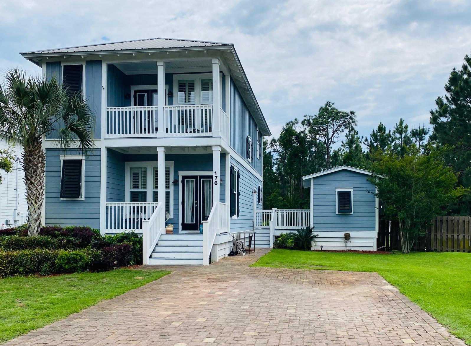Darling Florida Cottage on a large, private lot backing up to State Forest with tons of storage available for rent starting June 1st. Perfect location, minutes from beaches or shopping at Grand Boulevard. Downstairs, an open floor plan is flooded with light from large windows graced with plantation shutters. The dining area features a built in banquette. The kitchen was updated last year with new appliances, backsplash, under cabinet lighting and paint. Also downstairs is an office or possible fourth bedroom with access to the back porch, overlooking your large, private backyard complete with two storage buildings, one could easily be used as a workshop. Upstairs you will find a large master bedroom with sitting area, private balcony, walk in closet and large shower.. Across the hall, find two charming guest rooms with a Jack and Jill bathroom between them. Parking is not a problem with four driveway spots and ample room across the street. A must see! Call today!