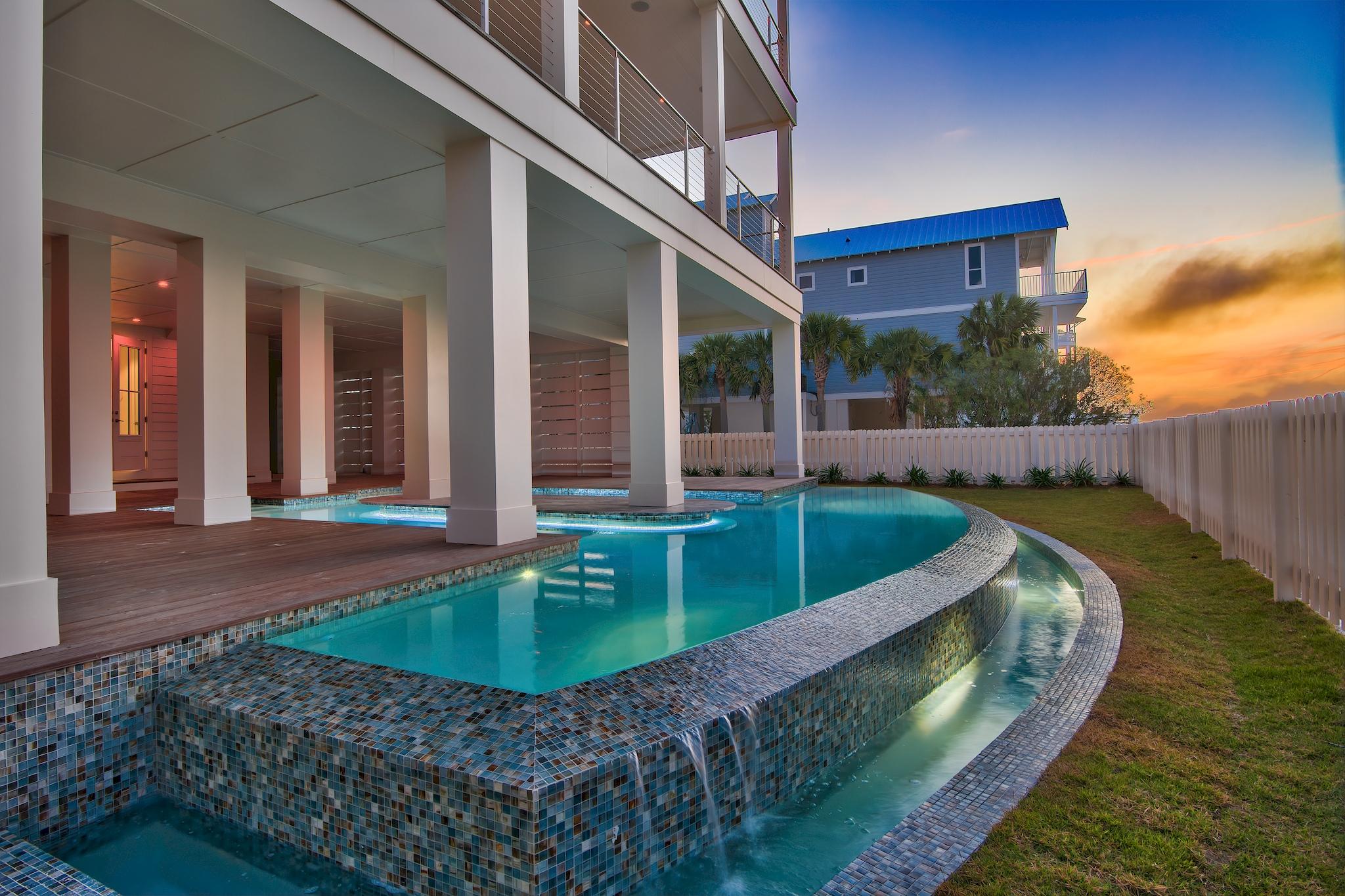 Welcome to paradise! Destin Pointe is the only gated beach community to boast two separate beach experiences in one beautiful gulf front community.
This newly constructed home has been built using only the finest materials and most current construction technology such as:
Insulation in every wall,
Sound proofing system in between floors, Exterior doors and windows rated to sustain wind and impact of 150 mph, Hardi board on exterior,
Cumaru wood decking on exterior living spaces and around pool, Salt water gunnite heated pool with swim up bar , Wolf and Subzero premium appliances, Custom showers,
Custom lighting,
Custom handmade cabinets,
Two tankless water heaters with recirculating system allowing for almost instantaneous hot water,
Click on ''More'' for additional informati Nano wall in main living space which opens completely to second floor deck, 
Hard wood flooring throughout,
Custom bunk room,
Custom iron railings,
Elevator, 
House is wired for sound and pre-wired to be a completely functional smart home,

The views from this home are unparalleled offering not only a view of the Gulf of Mexico but also beautiful views of the East Pass and Destin Harbor.  Don't miss your opportunity to own a piece of this one of a kind beach paradise.