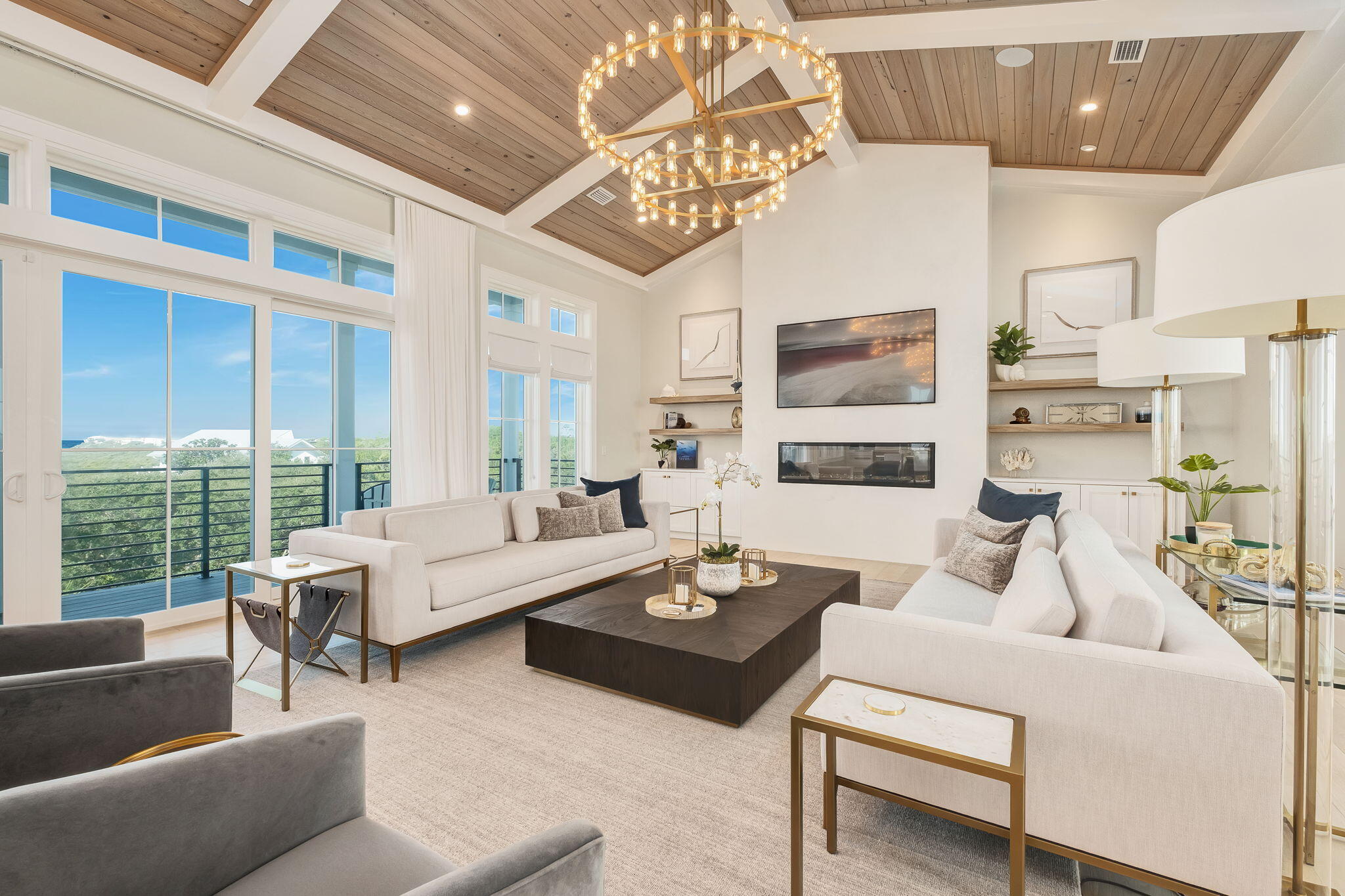 Welcome to your coastal dream home, nestled south of Scenic Highway 30A, in the gated community of Gulf Trace, highly sought-after for its incredible 1,400 feet of beachfront and offering an oasis of tranquility surrounded by the exquisite Grayton Beach State Park. Prepare to be amazed by this 5-bedroom masterpiece that has been meticulously remodeled from top to bottom, every detail designed with luxury in mind. You'll find the perfect outdoor entertainment space featuring a private pool framed by a patio ideal for sunbathing and a custom fireplace. Inside, jaw-dropping details include floor-to-ceiling windows framing some of the most stunning Gulf views, natural wide-plank flooring, vaulted tongue-and-groove ceilings, custom lighting, and a private elevator. The heart of this home is undoubtedly the third-floor principal living space, where you can gather around the modern fireplaceit truly serves as the stylish centerpiece of the room. Soaring vaulted ceilings with custom chandeliers, curated decor, and plush furnishings create an inviting atmosphere, making it the perfect setting to create unforgettable memories. The chef's kitchen is a culinary dream, equipped with professional-grade appliances including a six-burner gas cooktop, a custom range hood, and an oversized kitchen island with stunning waterfall countertops and seating for casual gatherings. For more formal occasions, you'll find additional seating for six in the elegant dining room, accompanied by a wet bar complete with a wine refrigerator and ice maker. Whip up your morning coffee in the butler's pantry just off the kitchen and dining area, which offers ample storage and a dedicated coffee bar! Take your relaxation to new heights on the fourth-floor observation deck, where the sunsets are nothing short of spectacular. Ascend to the second level and be welcomed by the spacious primary suite, boasting a spa-like bathroom complete with double vanities and a large walk-in showeryour personal sanctuary awaits! This level also features three additional luxurious king bedrooms, each with its own ensuite bathroom, providing privacy and comfort for everyone. The first floor features a bunk room and a full bath that conveniently doubles as a pool bath for your guests. Plus, there's an oversized two-car garage and a private elevator for added convenience.