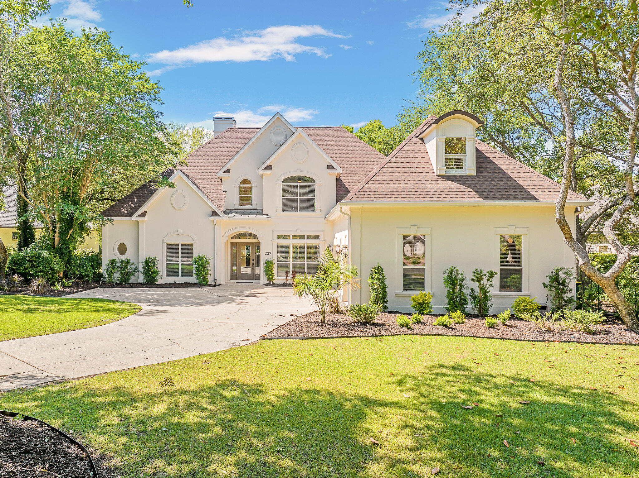 Now available with a lease-to-own option, this homeTucked behind the gates of the coveted Kelly Plantation community, 237 Mattie's Way is a refined 4-bedroom, 6-bath estate that embodies timeless luxury. Framed by mature oaks and lush, manicured landscaping, this exquisite property offers a sense of arrival, serenity, and seclusion.
Upon entering, you're greeted by a grand and airy open-concept layout designed for effortless entertaining and upscale living. The main level showcases two elegant living spaces, a formal dining room, a full-service wet bar, and an expansive gourmet kitchen featuring a central island, peninsula with bar seating, walk-in pantry, and casual dining area - ideal for hosting intimate dinners or lavish soirées. The primary suite on the main floor is a private sanctuary, with its own entrance to the rear of the property. The luxurious ensuite bathroom offers dual vanities, a spa-style jacuzzi tub, water closet, built-in makeup vanity, and an oversized walk-in closet. 
Ascend to the second level, where a thoughtfully designed entertainment lounge with a wet bar becomes the heart of the upstairs living space. This floor features two additional bedroom suites, each with private bathrooms and walk-in closets, as well as a spacious bonus room or fourth bedroom with its own ensuite bath and closet. A second laundry room and generous storage spaces further enhance the convenience and functionality of the upper level.
Step outside to a private backyard oasis designed for year-round enjoyment. The expansive screen-enclosed lanai surrounds a resort-style pool and 7+ person spa, perfect for relaxing under the stars or hosting poolside gatherings. A custom-designed, removable child safety fence ensures peace of mind for families. Beyond the lanai, the property opens to a tranquil natural setting - the perfect backdrop for evening bonfires or outdoor entertaining.

Enjoy 18 holes of championship golf, tennis and pickleball courts, two parks with playgrounds, scenic walking and jogging trails, an equestrian center, a dog park, a fitness facility, an owners' club with dining, and a community pool. You can also cast a line in the many ponds throughout the neighborhood. Just beyond the gates, you'll find a variety of restaurants, shops, and everyday conveniencesand of course, you're only minutes away from the stunning sugar-white sands of the Emerald Coast.