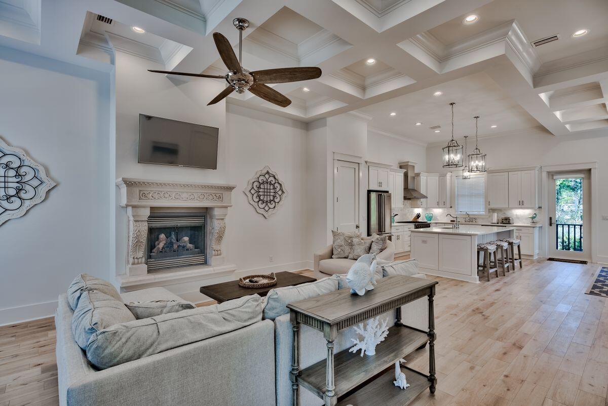 Opportunity abounds with this gorgeous five-bedroom home completed in 2019, prominently located in the highly desirable gated community of Palmeira Villas in the heart of Seagrove Beach adjacent to exemplary beach access and in close proximity to all of the world class restaurants and boutique shopping that 30A has to offer. This beautiful mediterranean villa has never been rented and presides over a gorgeous gulf view corridor and is characterized by an impressive three story vertical footprint providing beautiful coastal decor and professional furnishings throughout this five bedroom retreat. Notable features include an open floor plan complete with 12' ceilings on the first level as well as ample space in the front parking court and a recently added splash pool and comfortable outdoor patio area. The thoughtfully designed layout optimizes living space designed with a chef's kitchen and living room on the first level complete with stainless appliances, quartz countertops and custom cabinetry as well as a built in wet bar and beverage station adjacent to the oversized living room. The second level features 3 bedroom suites primely situated for ideal privacy and enjoying well appointed ensuite bathrooms. The master suite is a true retreat located on the third level and offering beautiful gulf views as well as an ensuite master bathroom complete with soaking tub, walk in shower & dual vanities. The third floor also offers an additional guest suite with ensuite bathroom as well as rare gulf views from the south facing elevation. Palmeira Villas is one of the few truly gated enclaves along scenic highway 30A and is centrally located within a short bike ride to Seaside and Watercolor with easy access to Highway 98 and walking distance to a few local restaurant favorites including Angelina's and Cafe 30A. This property was designed for flexible use and would make an ideal short term rental income producer or second home.