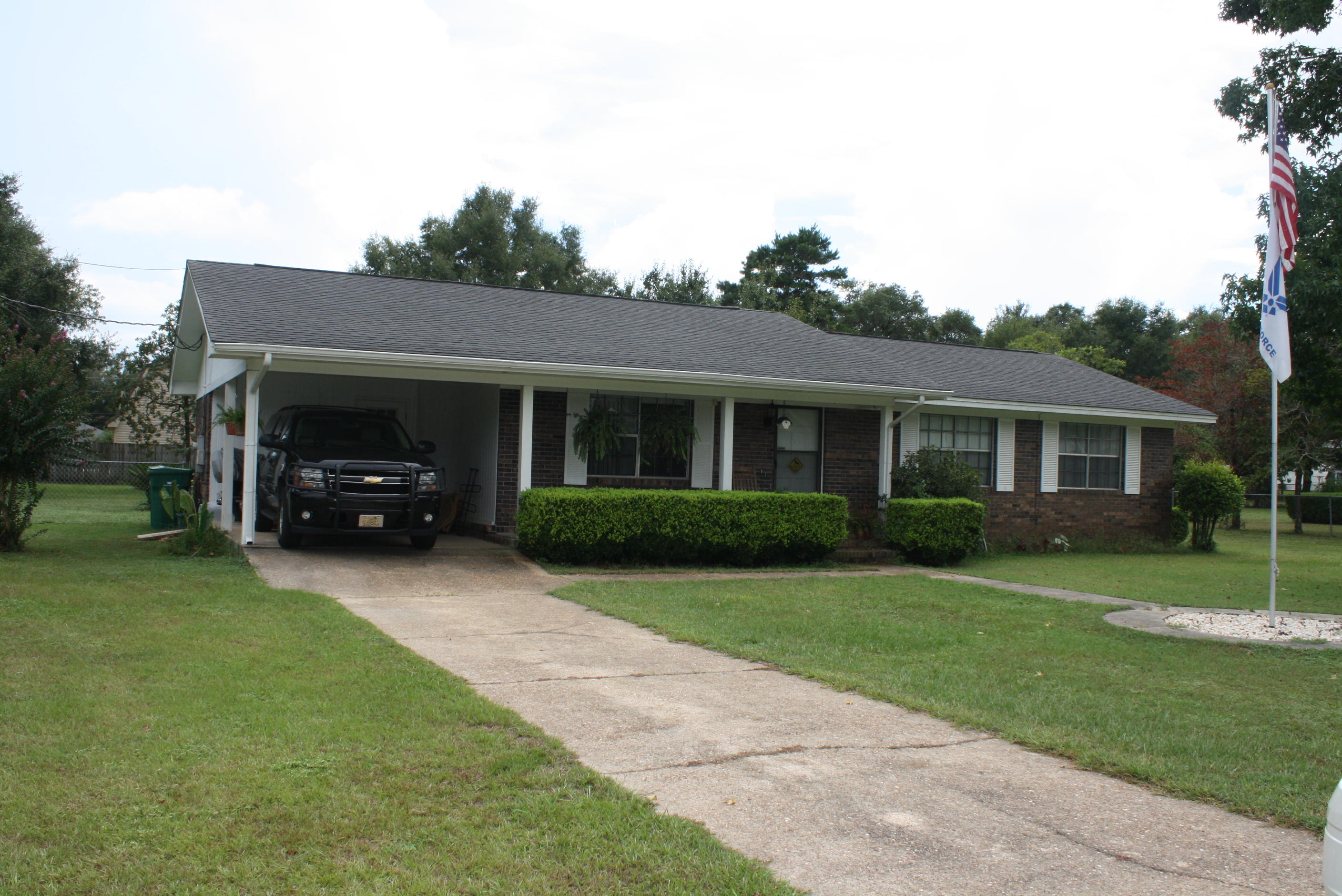 Looking for a quiet location to enjoy the outdoors? This is the perfect home! Situated on over half an acre of property, the back yard is a dream! The backyard is fully fenced and the front yard is spacious as well. The home is a 3 bedroom, 2 FULL bath that lives large. Living room is carpeted and has ceiling fan. The kitchen opens into a dining room and features a breakfast bar, smooth top stove/oven, fridge, and dishwasher. The hall bathroom has double sinks. All bedrooms feature carpet and ceiling fans. Indoor laundry room has entry to backyard and is very large with additional storage. Carport for all your covered outdoor storage of vehicles. Come view this property today!