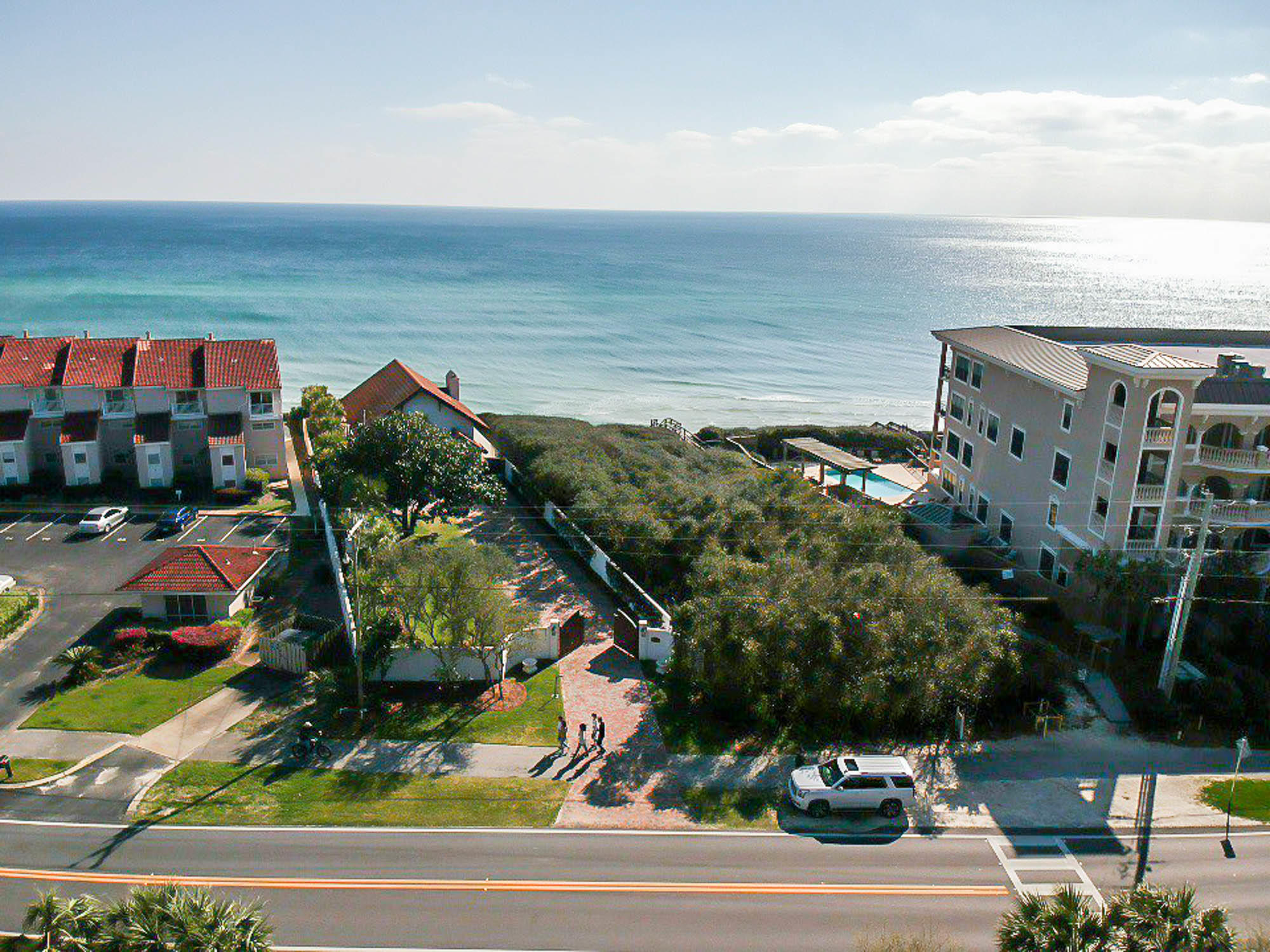 Expansive gulf-front home-site, sitting approximately 38 feet atop sea level, encompassing .60 acres and 64.43 feet of gulf frontage. Astonishing views of the sugar white sands and emerald waters of the Gulf of Mexico will be enjoyed by the future homeowner. But it does not end there - it is only befitting for an estate such as this to have a dwelling of equivalent immensity. Meticulously crafted and customized architectural plans for a beachfront manor will convey with the sale. These plans feature 7,320 s.f. heated and cooled, 2,739 s.f. covered porches, 1,371 s.f. of garage space, 10 bedrooms, 12 full bathrooms and 1 half bathroom.
Pay attention to the lot placement, adjoining parcels and the architectural design; you will realize nearly 180-degree views from this magnificent
