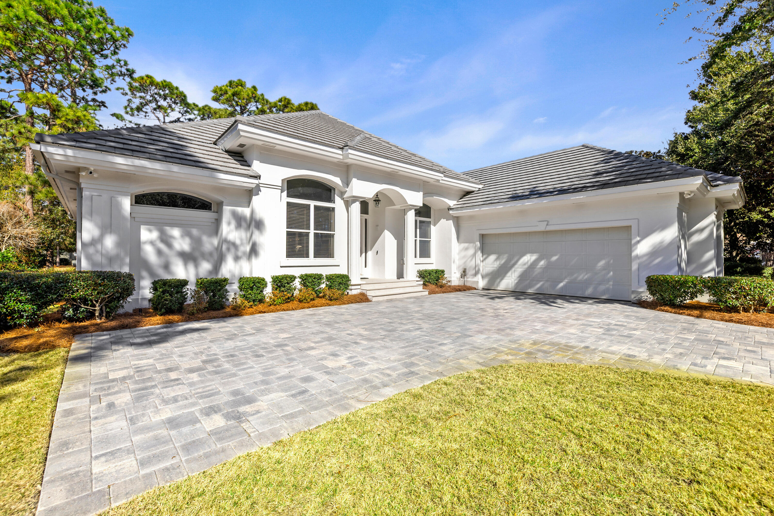 This beautifully renovated single-story home exemplifies refined coastal living, offering four bedrooms—one currently utilized as an office. Located within the esteemed Baytowne Community at the Sandestin Golf & Beach Resort, the property features recent upgrades, including a new roof, HVAC system, and water heater for enhanced comfort. A reinvisioned modern kitchen is equipped with an expansive island, stainless steel appliances, and high-end designer finishes, complemented by an informal dining area and a sophisticated wet bar—ideal for entertaining. The primary suite provides an updated ensuite bath and a spacious custom walk-in closet. An enclosed patio offers an inviting space for dining or gatherings. The oversized garage accommodates two vehicles and two golf carts. Every aspect of this fully updated residence reflects attention to detail and quality craftsmanship.