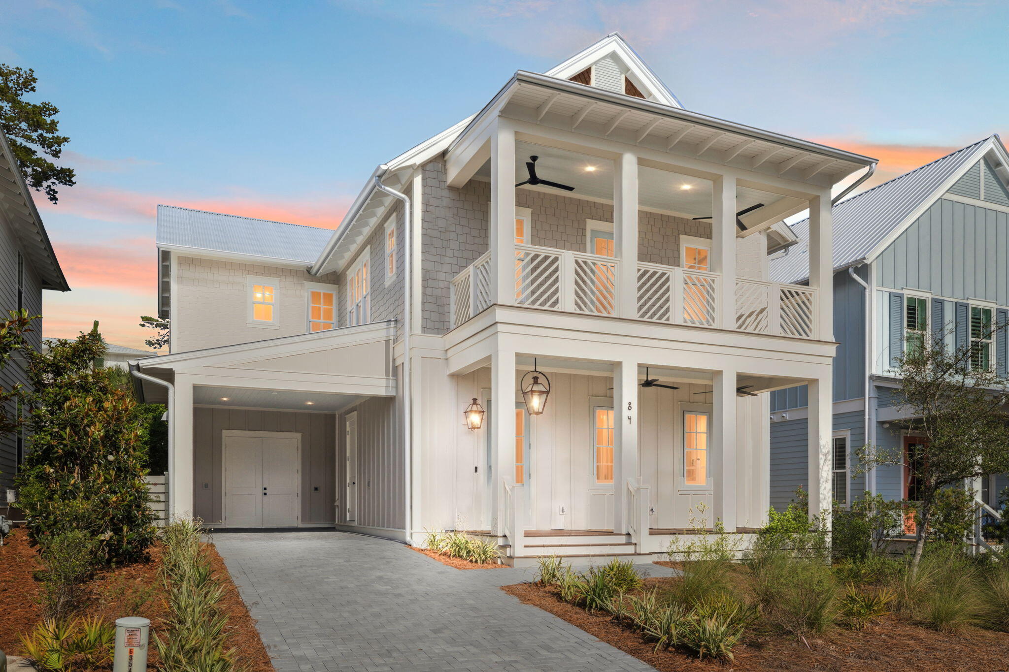 Fully furnished and rental ready, brand new construction in sought after neighborhood of Lakeside At Blue Mountain Beach. This boutique community offers amenities including pool, clubhouse, playground, access to Redfish Village and public beach access. As you enter into the elegant foyer of this stunning home, professionally decorated and fully furnished, you are greeted with light engineered wood flooring taking you to the open area concept living and dining area. The gourmet kitchen features all Thermador stainless steel appliances including a gas stove with chimney style range and French Door refrigerator. Quartz countertops, an abundance of storage cabinets, and a wine bar complete the kitchen. First floor primary room has an ensuite bath with walk-in closet. A powder room and laundry closet finish the first floor. The stairs will lead you to the oversized living area loft with built in bunk beds. All 3 bedrooms upstairs have an ensuite bathroom and walk-in closet with a balcony off the upstairs primary bedroom. A large laundry room finishes the second floor. The carport offers a storage room as well. This home also boasts a tankless water heater and 2 HVAC units.