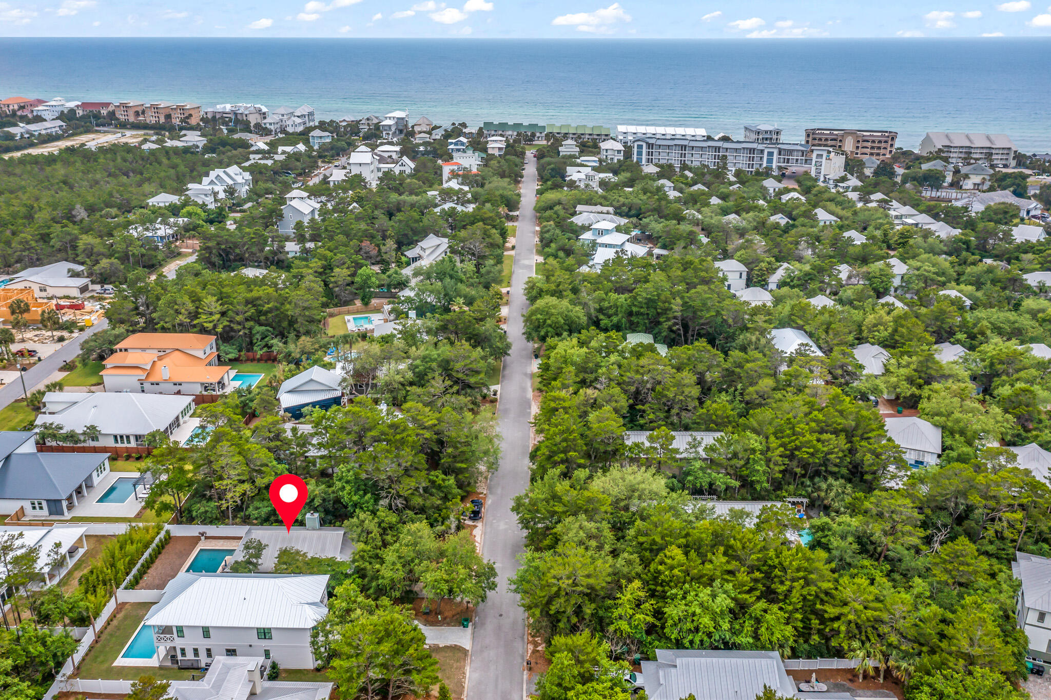 Nestled in the charming and serene coastal community of Seacrest, Florida, lies an exquisite property that embodies the essence of coastal living at its finest. Introducing 250 Clareon Drive - a stunning residence that boasts luxurious finishes, impeccable design, and serene views. 

Upon arrival, you will be greeted by a beautifully manicured lawn and an inviting entrance that leads to a spacious foyer, setting the tone for the grandeur that awaits. The open concept living and dining areas are bathed in natural light and offer seamless indoor-outdoor living, with easy access to the expansive covered porch that overlooks the lush landscape.