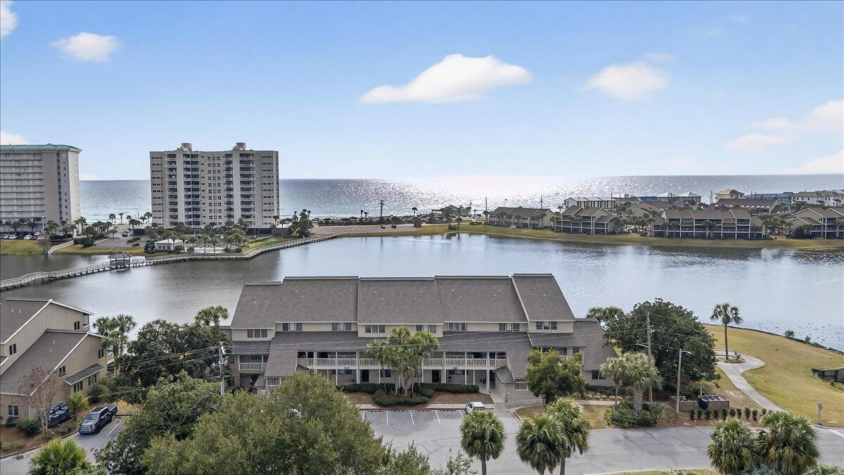 Nestled within Seascape Resort, this 3BR/3BA residence captures the timeless charm of Miramar Beach with a refined, relaxed coastal elegance. Two expansive balconies offer tranquil views of Stewart Lake and the Gulf, where ducks, herons, and native wildlife create a peaceful setting, comfortably removed from the bustle of nearby high-rise properties.

Extensively renovated with over $90,000 in improvements, the home features updated kitchen counters, backsplash, cabinetry, renovated baths with a newly added master shower, new flooring, HVAC system, carpet, and fresh interior paint. Offered fully furnished and newly returned to market, the transformation is remarkable.

Residents enjoy access to five pools, tennis, pickleball, golf, basketball, beach access, and private beach parking. Unit 293 is one the rare units with a large storage shed located conveniently right by the parking lot.  You can easily store multiple bikes and beach gear!  

Also, Seascape Resort is in the middle of major upgrades that are elevating the entire resort experience:
" The Topeka concert venue is being redesigned with better aesthetics, parking, and traffic flow  already driving thousands of rental nights each year
" A brand-new north entrance road with improved access, sidewalks, and guardhouse is about to begin
" The Grove has delivered 97 new units and is adding resort-style amenities like a lazy river, pickleball courts, and green space
" Future plans include a redesigned executive golf course and clubhouse

This is the rare combination of value, views, renovation, and rising resort appealall in one property.

If you've been waiting for the right Seascape opportunity, this is it.